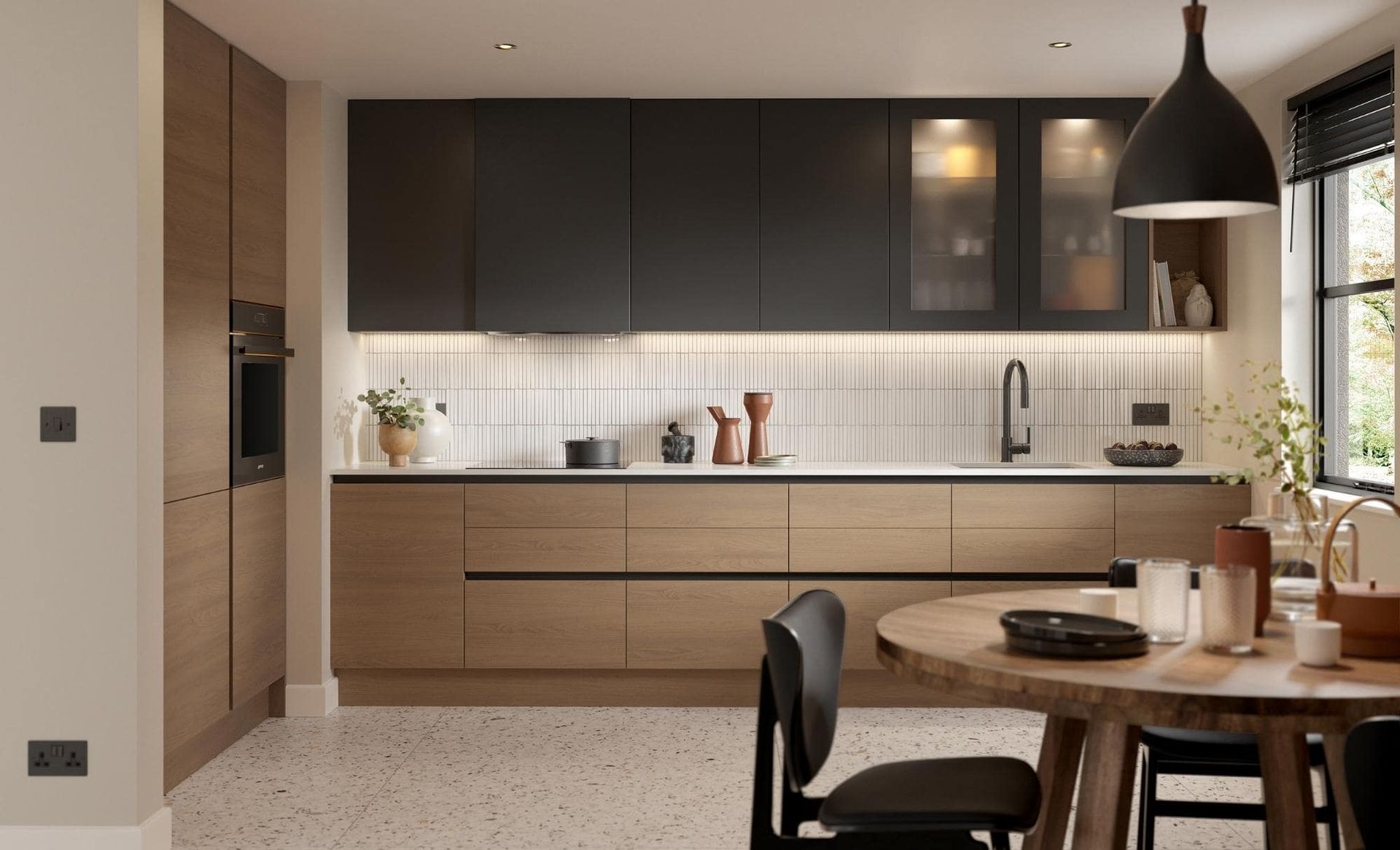 Modern kitchen with dark upper cabinets, wood-toned lower cabinets, white slatted backsplash, and a round dining table.