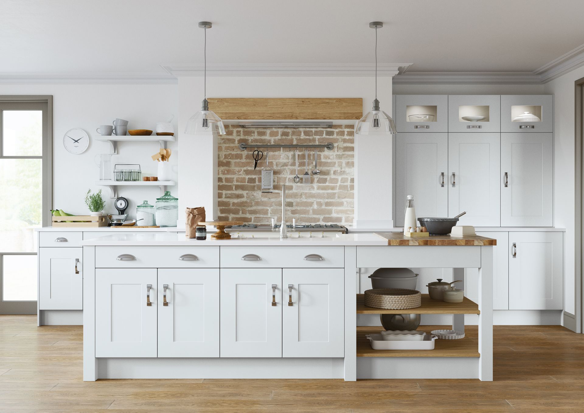 A bright kitchen with white cabinets, a central island, an exposed brick backsplash, and light wood flooring.