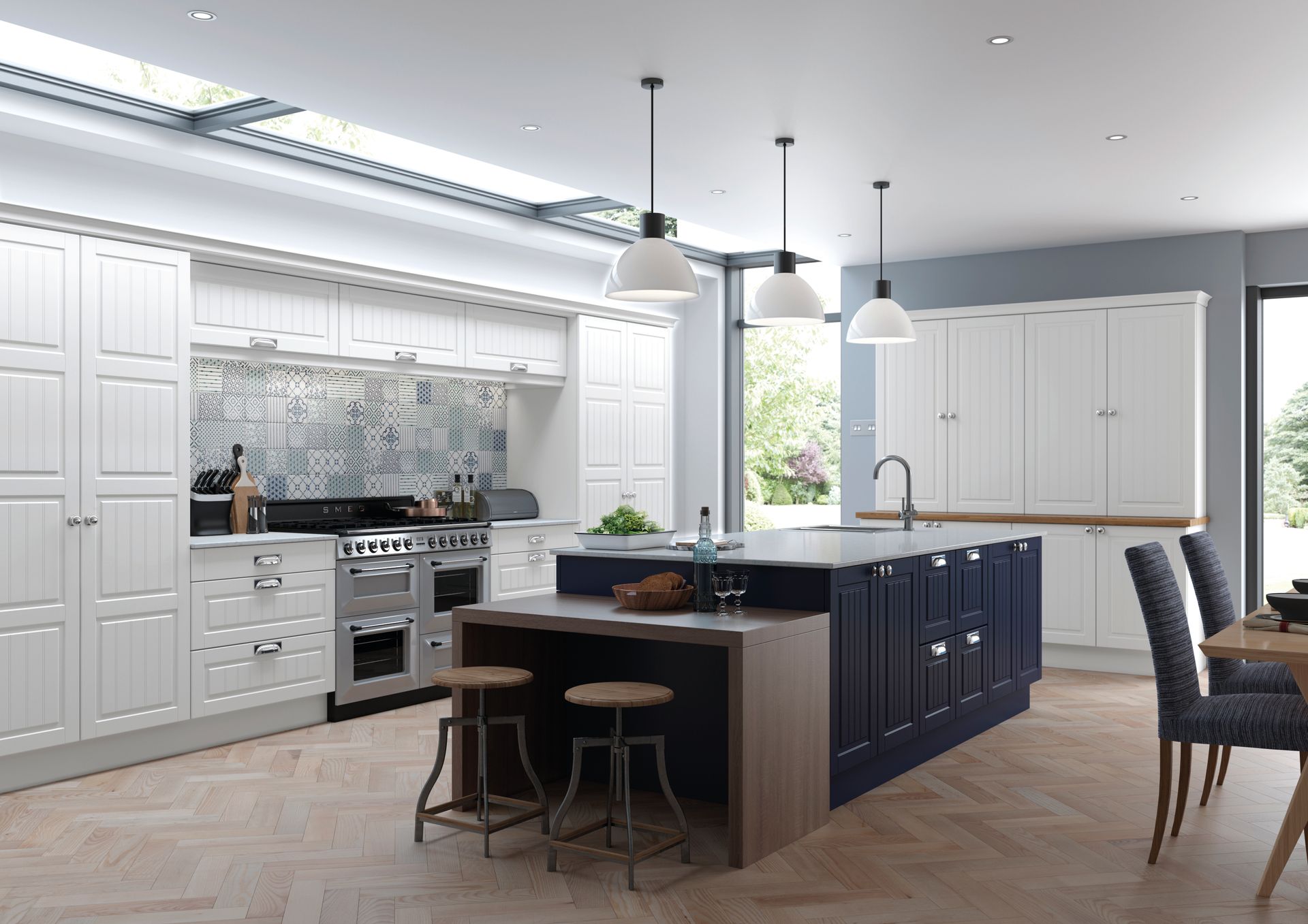 A spacious kitchen featuring white cabinetry, a dark blue island with wooden seating, and herringbone wood floors.