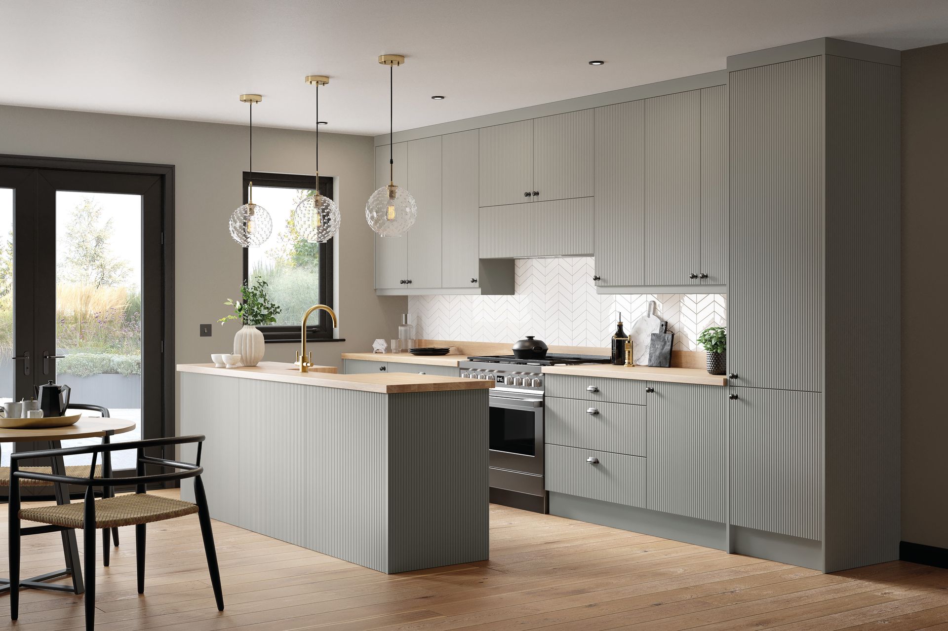A modern kitchen featuring sage green ribbed cabinets, a light wood countertop, and hanging pendant lights.