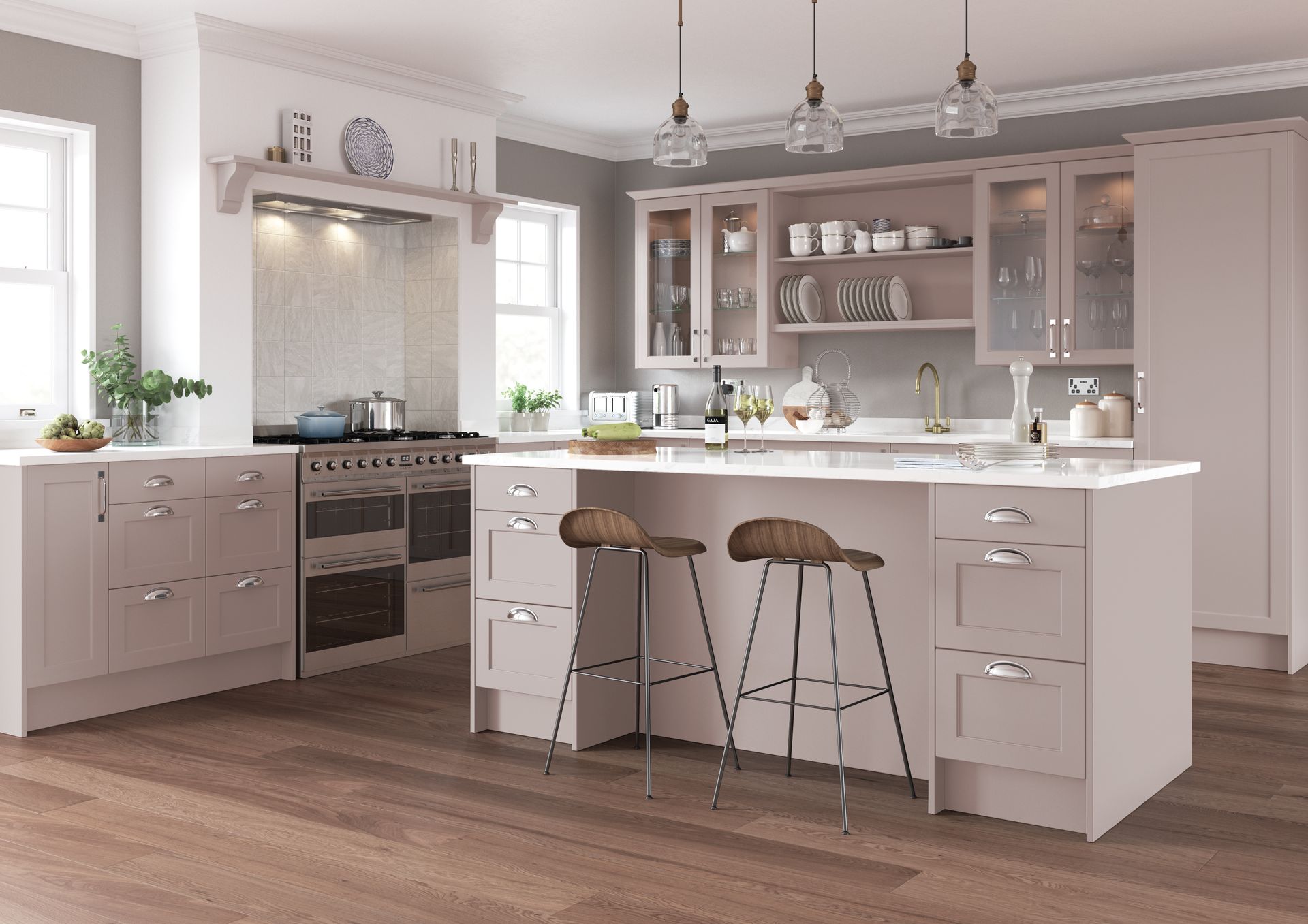 Modern light-pink kitchen with a central island, bar stools, stainless-steel range, and wood-look flooring.