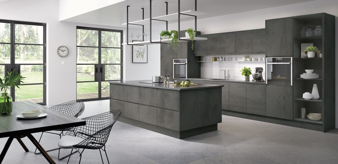 Modern dark gray kitchen with a central island, built-in appliances, open shelving, and large glass patio doors.