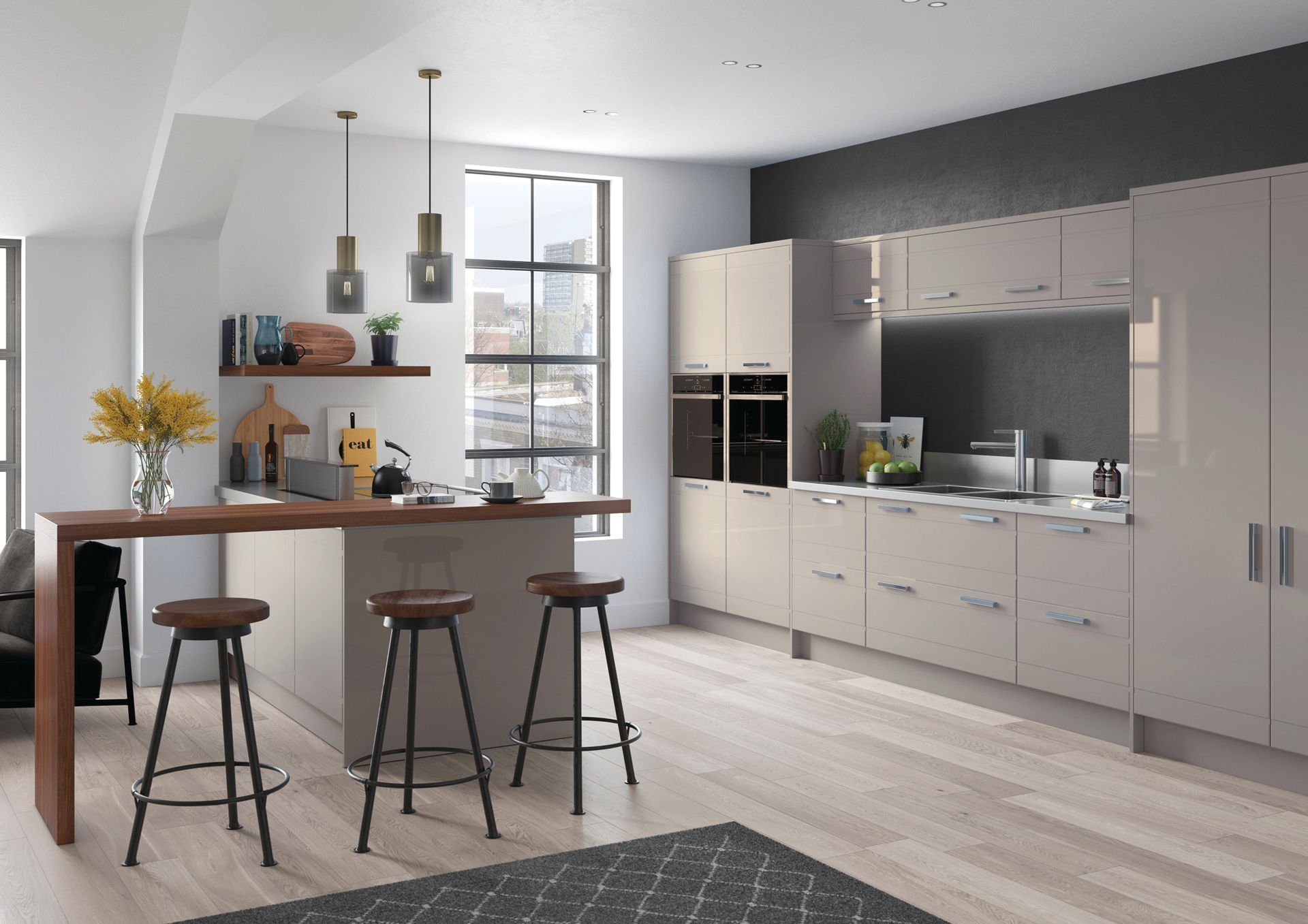 A modern kitchen with light grey cabinets, a wooden breakfast bar with three stools, and a tall window in a bright space.