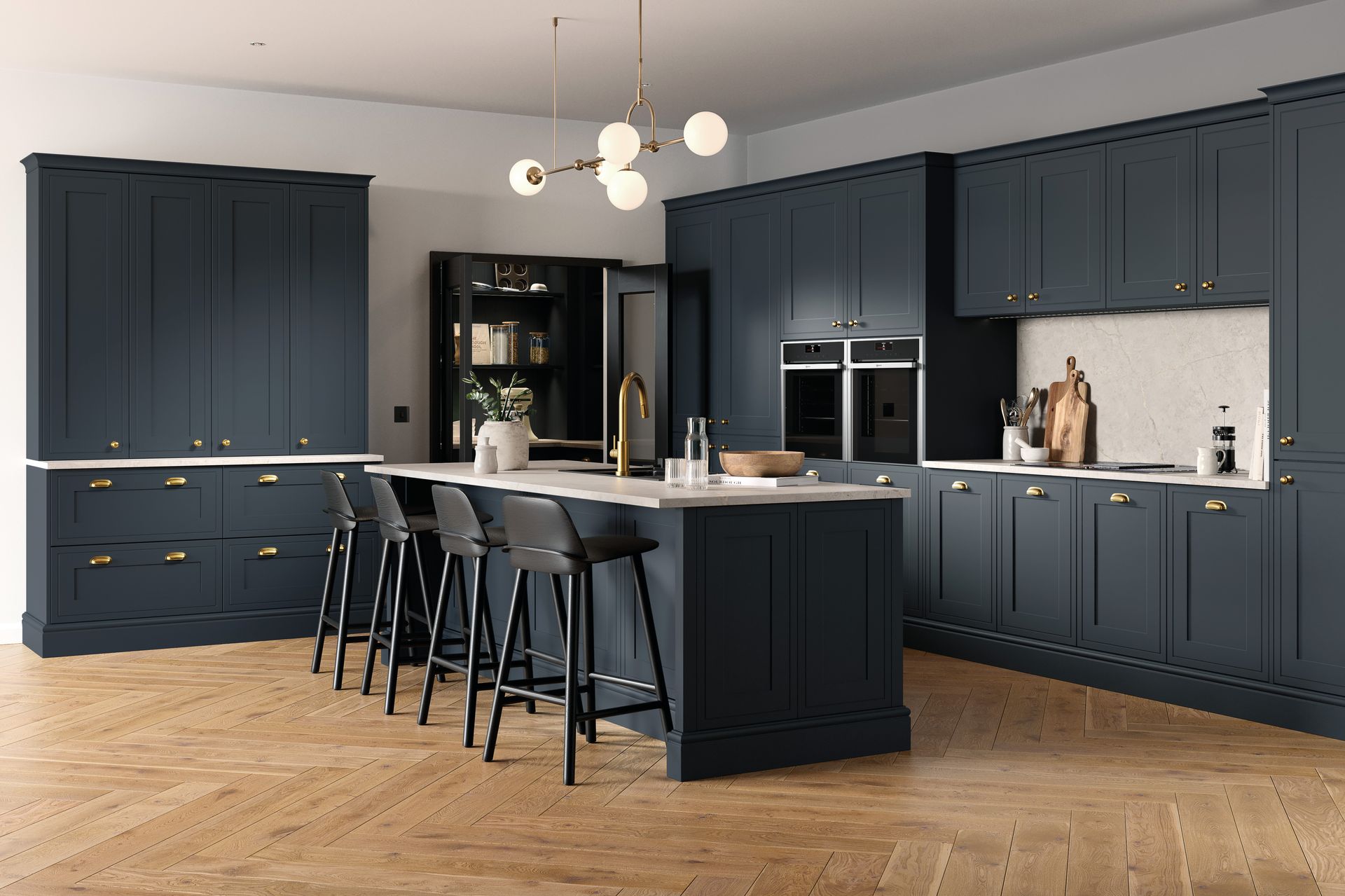 A modern kitchen features dark navy cabinets, a white marble island with three bar stools, and light wood herringbone floors.