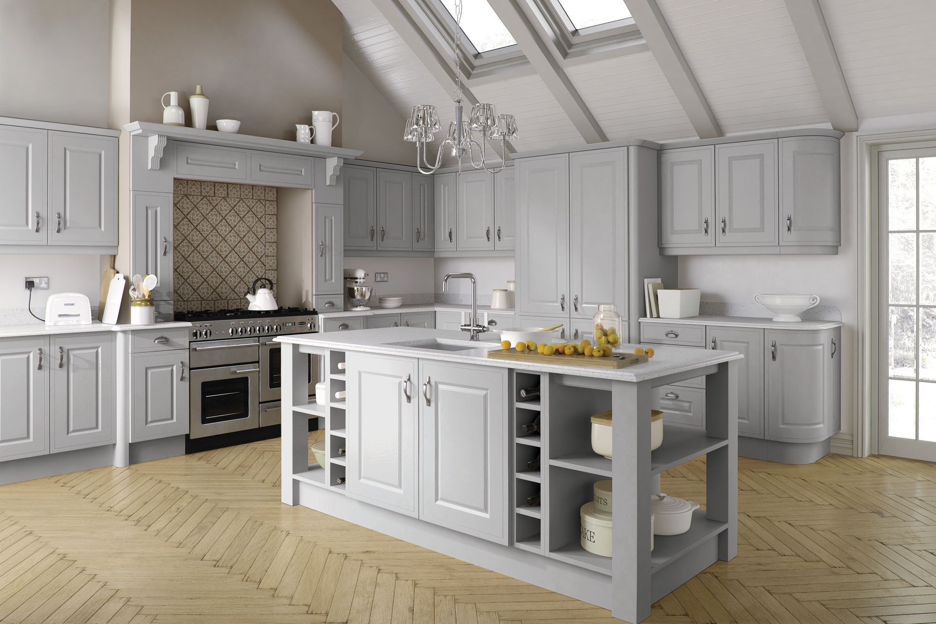 A modern kitchen with grey shaker-style cabinets, a central island, stainless steel range, and light wood flooring.