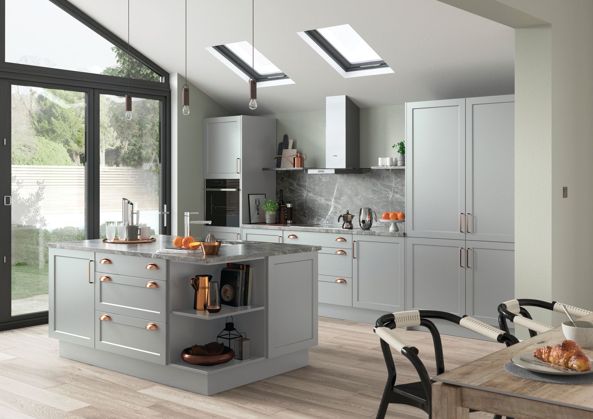 Modern gray kitchen with a central island, stainless steel appliances, marble backsplash, and skylights.