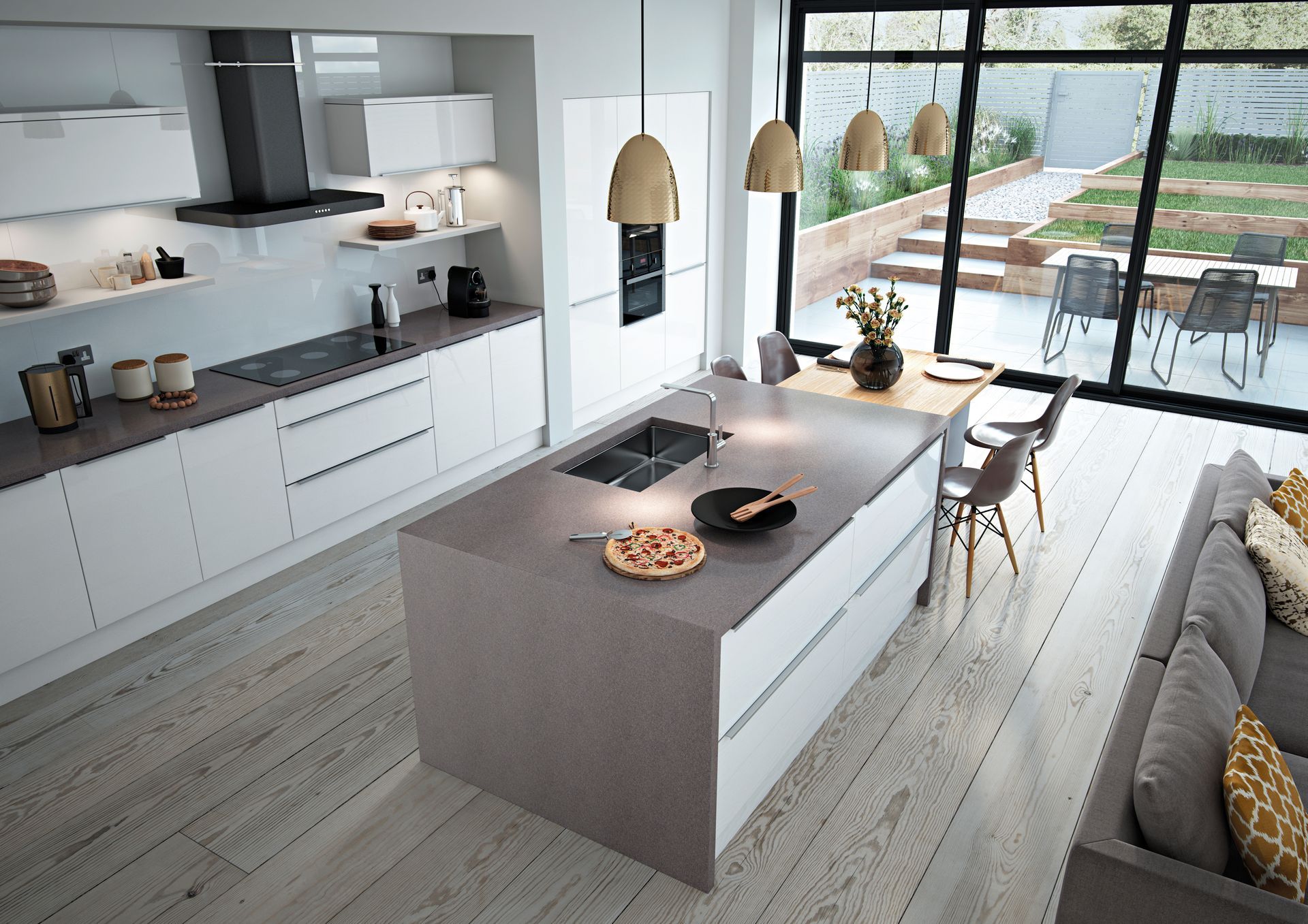 Modern kitchen with a central island, white cabinets, grey countertops, and wooden flooring, overlooking a patio.