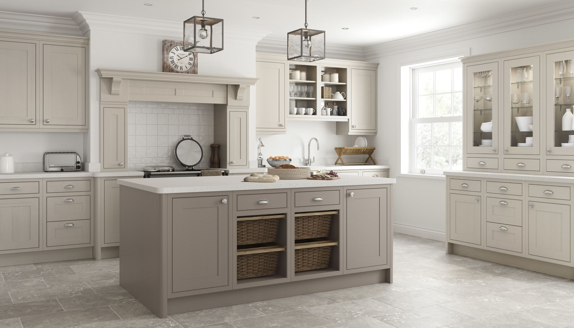 A spacious, bright kitchen with beige cabinetry, a central island with wicker baskets, and two pendant lights.