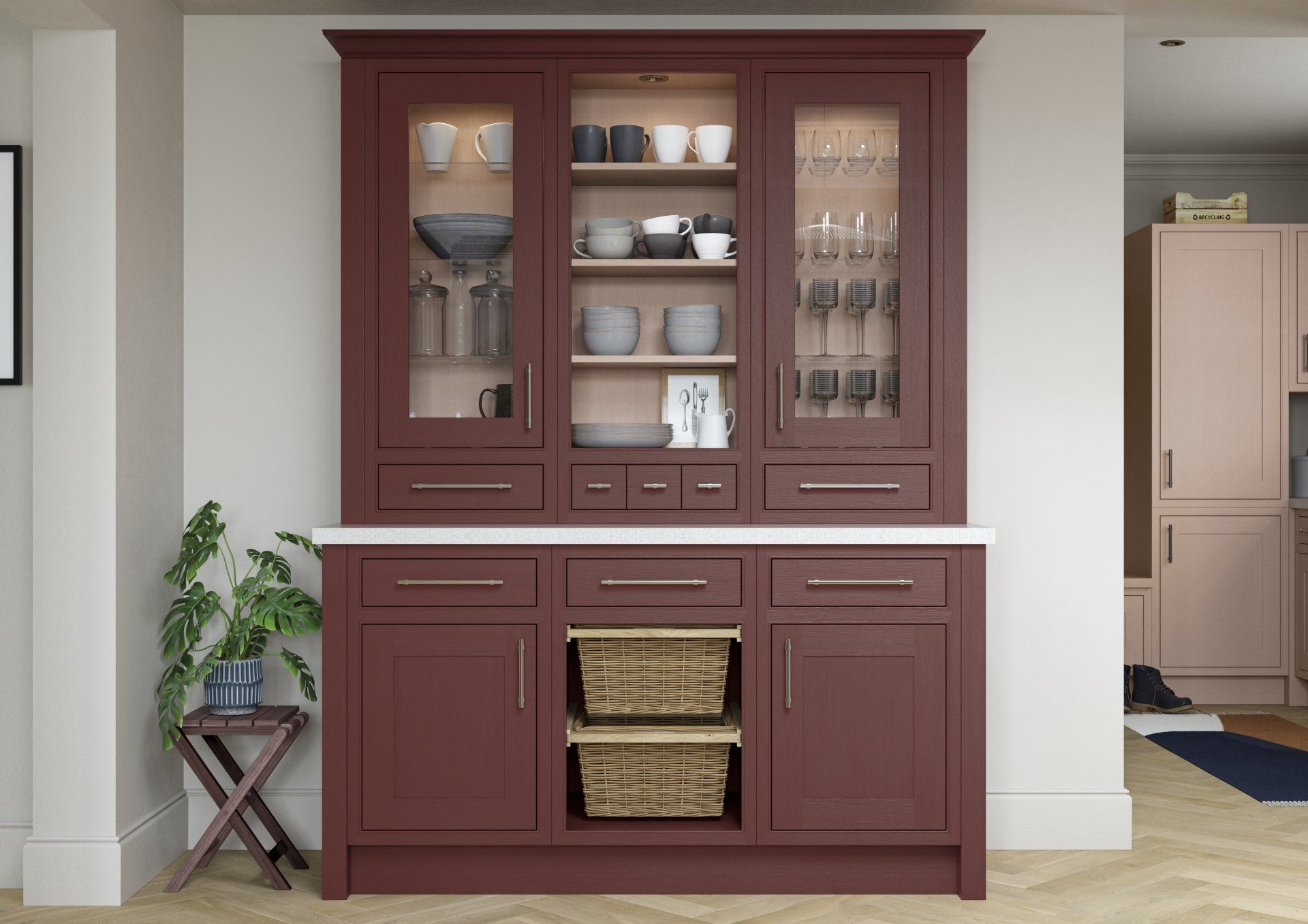 A deep red hutch cabinet with glass-front display shelves, drawers, and open shelving with two woven baskets.
