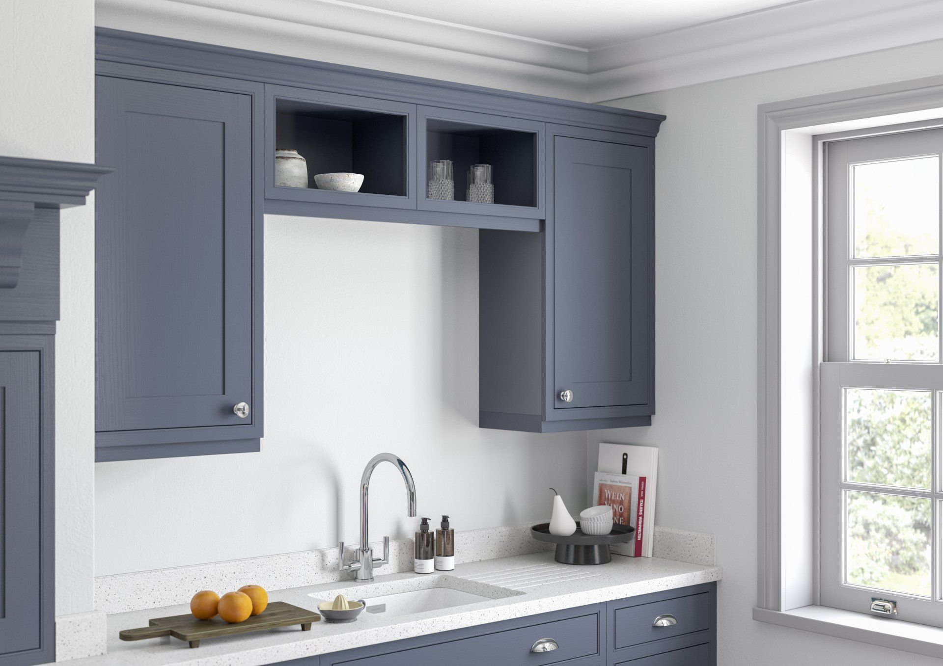 A kitchen sink area features slate blue cabinets, white countertops, and open shelving beneath a crown-molded top.