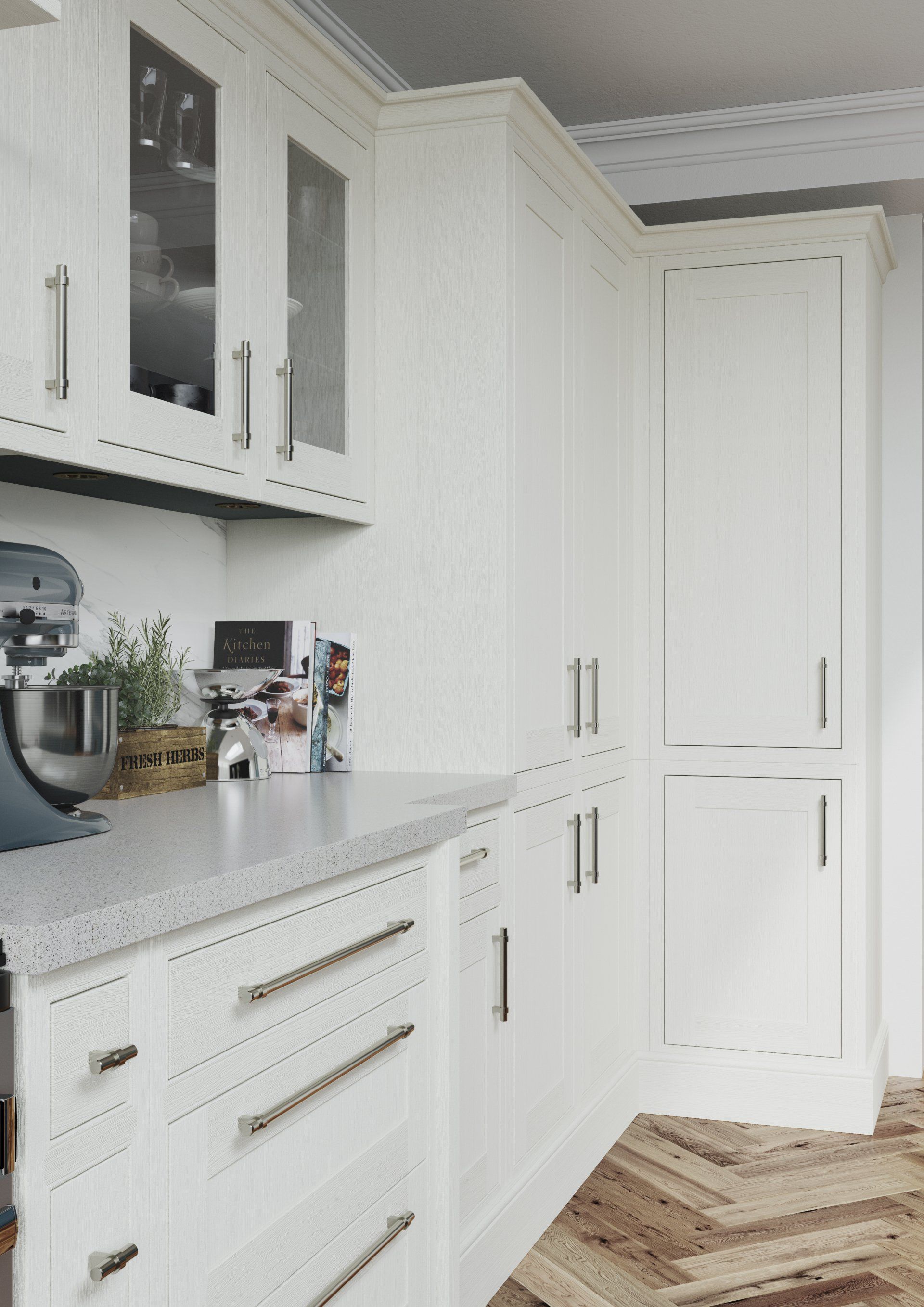 A modern, bright kitchen featuring white shaker cabinets, silver handles, a granite countertop, and herringbone floors.