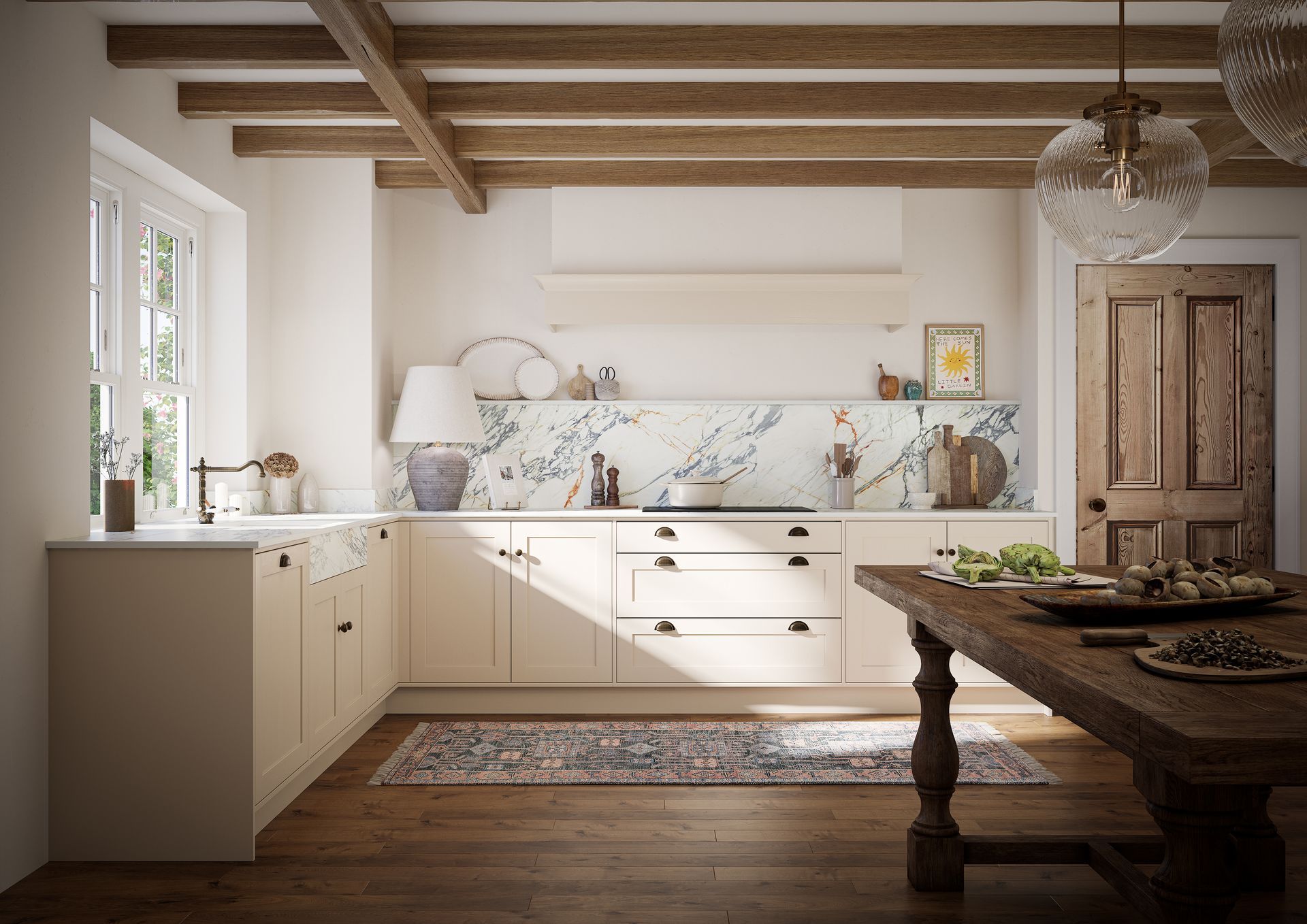 A rustic kitchen with cream cabinets, wood ceiling beams, a marble backsplash, and a wooden table in the foreground.