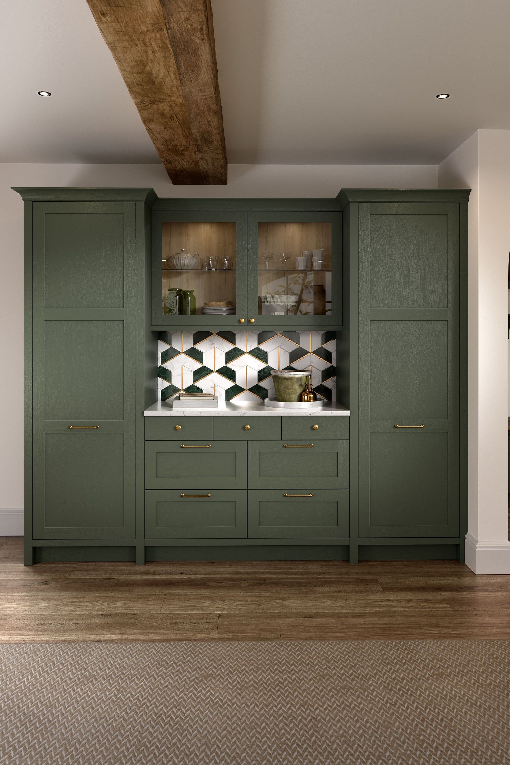 A dark green kitchen cabinet unit with a central hutch, patterned backsplash, and gold hardware against a white wall.