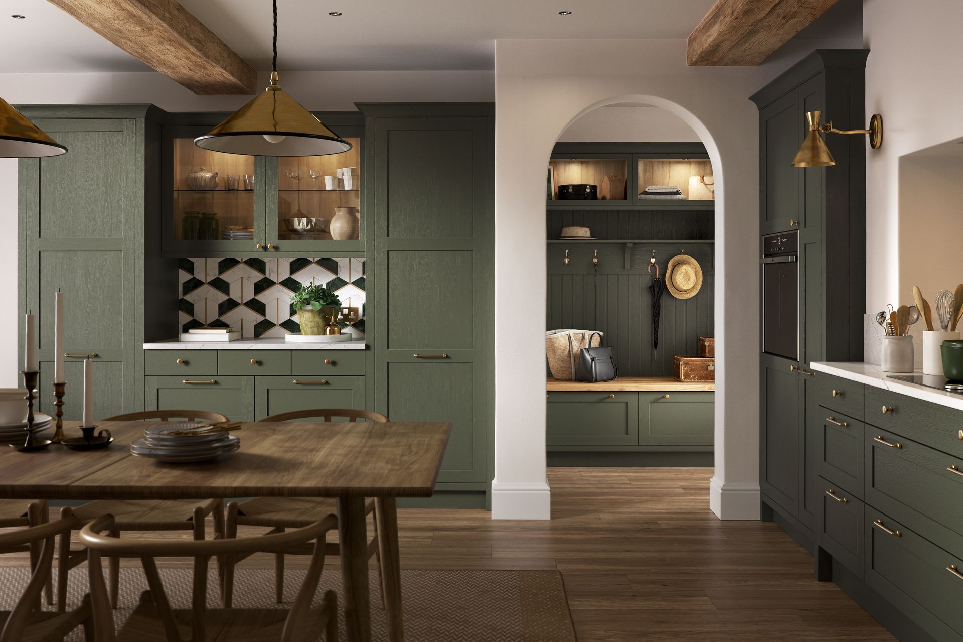 A kitchen and dining room with deep green cabinets, a wood dining table, and an arched doorway to a matching mudroom.
