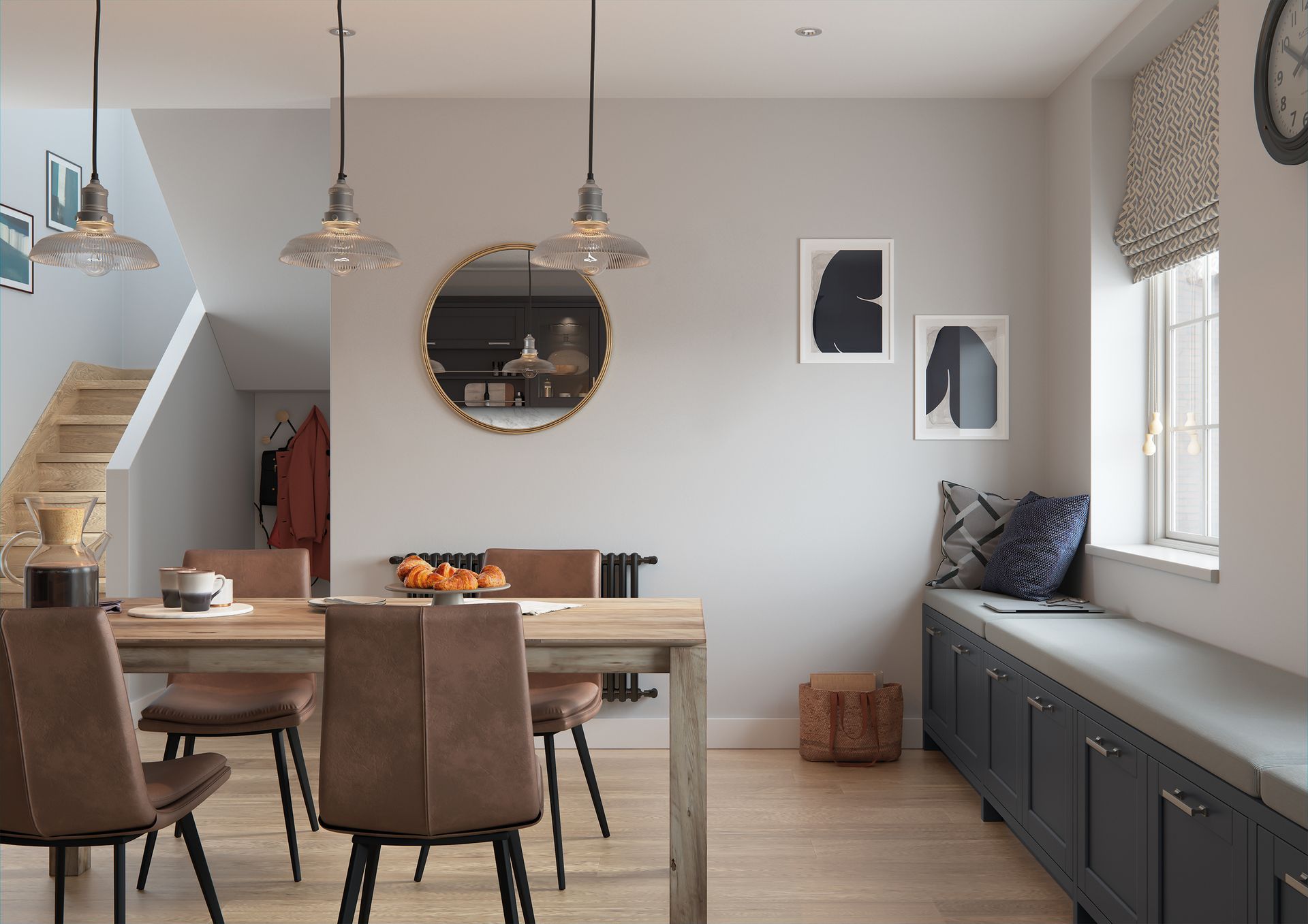 A dining room with a wooden table, brown chairs, three pendant lights, a wall mirror, and a window seat with storage.