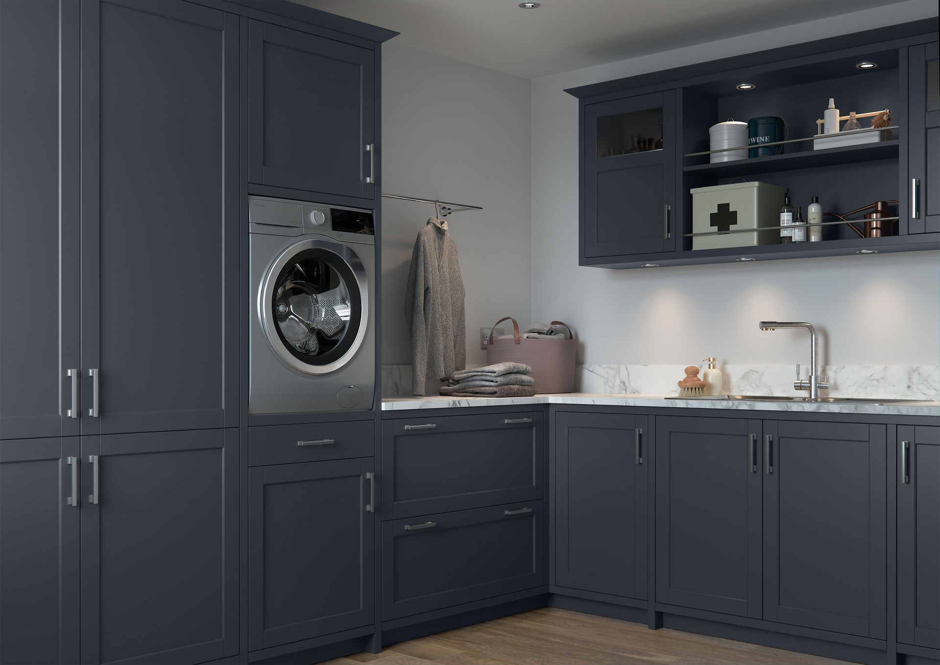 A modern utility room featuring dark blue cabinetry, a built-in washing machine, a sink, and open shelving.