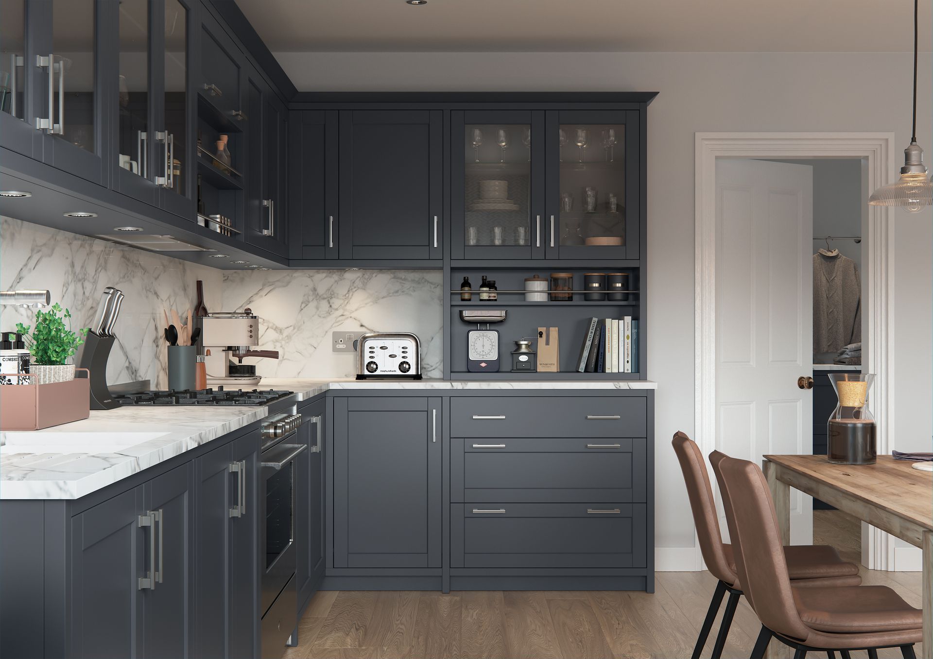 A modern kitchen with dark gray cabinets, white marble countertops, and a dining area with wooden chairs.
