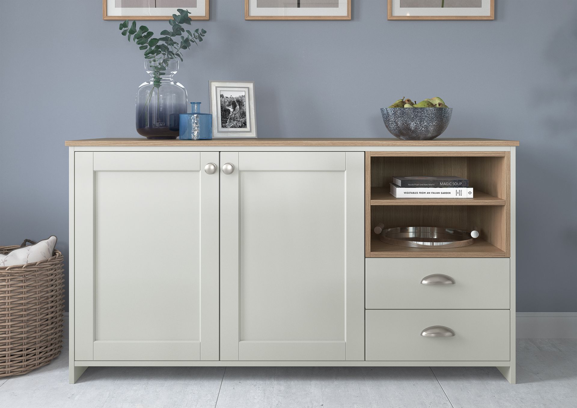A light grey sideboard with two cabinet doors, two drawers, and an open wood-toned shelf against a blue wall.