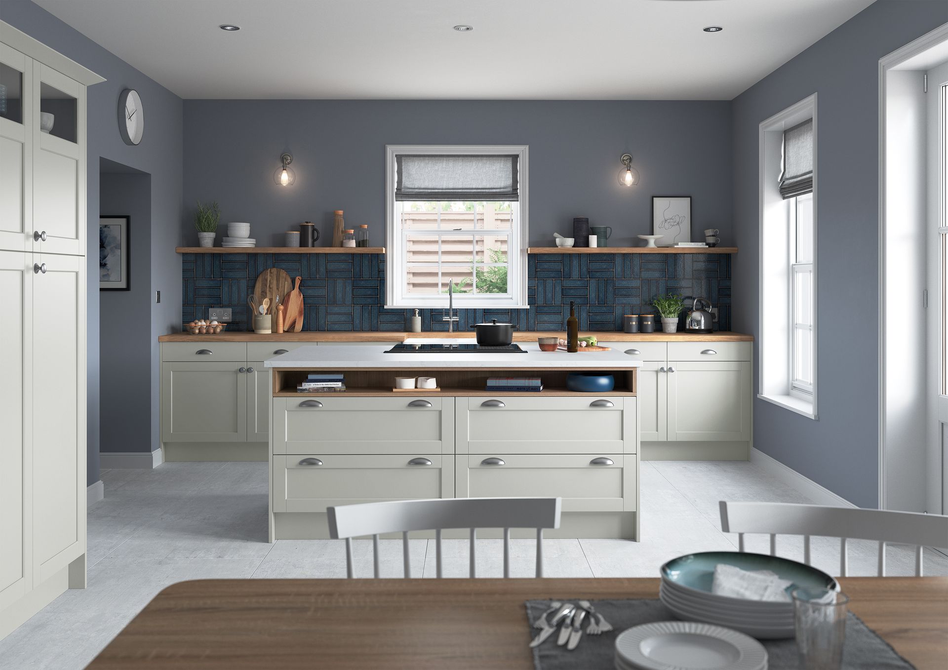 Modern kitchen with cream cabinets, blue tiled backsplash, gray walls, central island, and a wooden dining table.