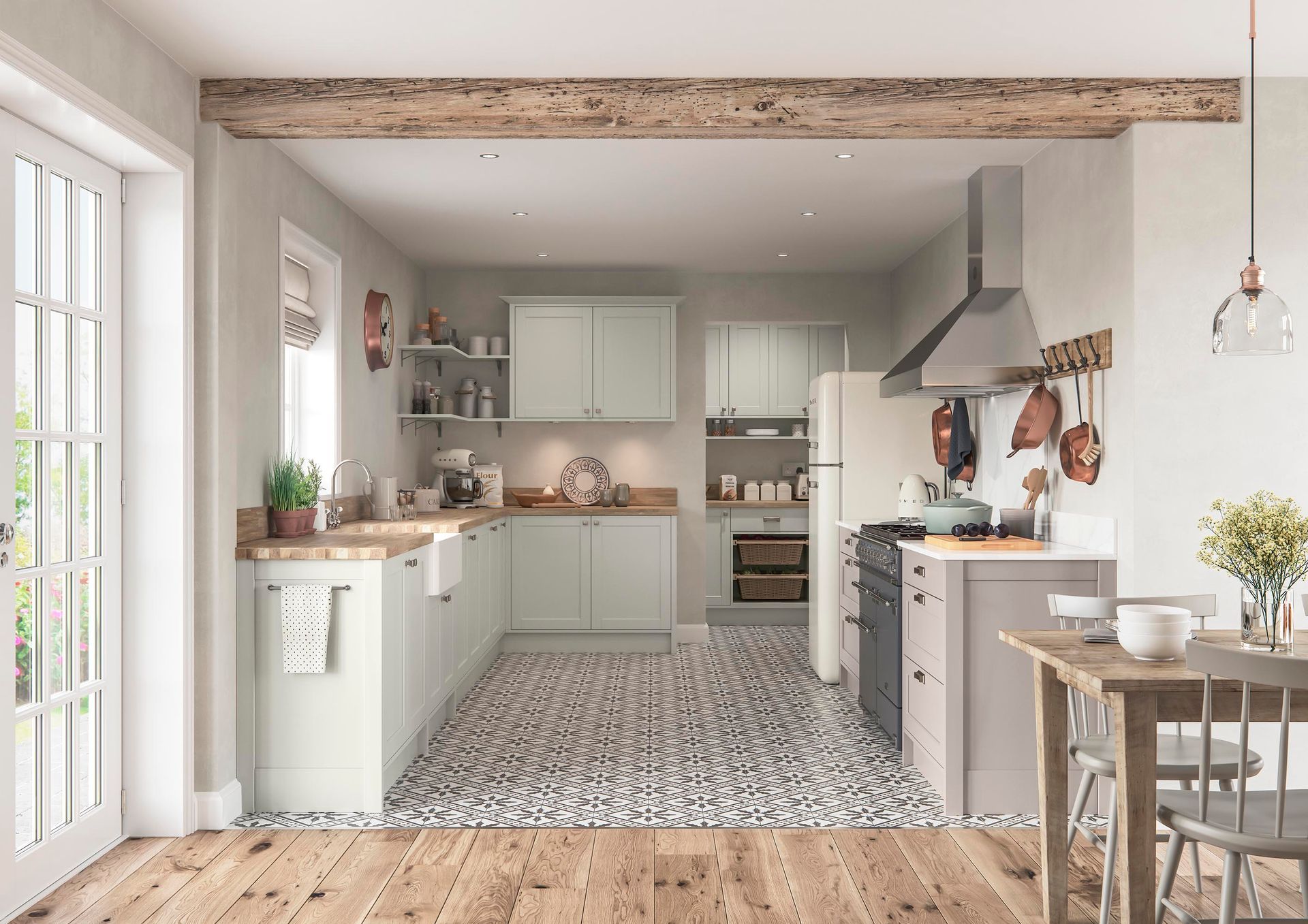 A light-colored kitchen featuring pale green cabinets, wood countertops, a patterned tile floor, and a rustic wood beam.