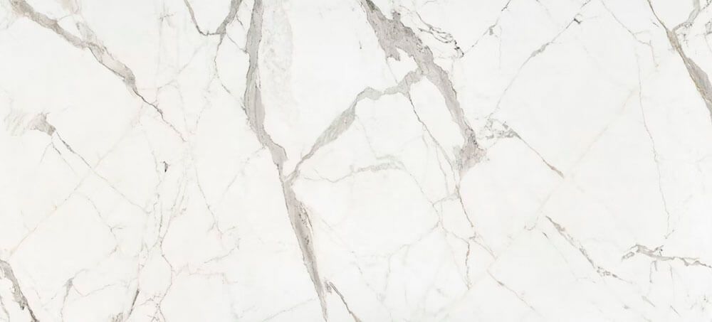 White marble texture with prominent, thin grey veins branching across the surface.