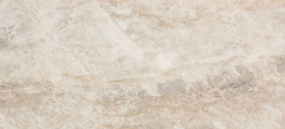 A slab of polished beige marble with subtle white and grey veins and soft, blended textures.