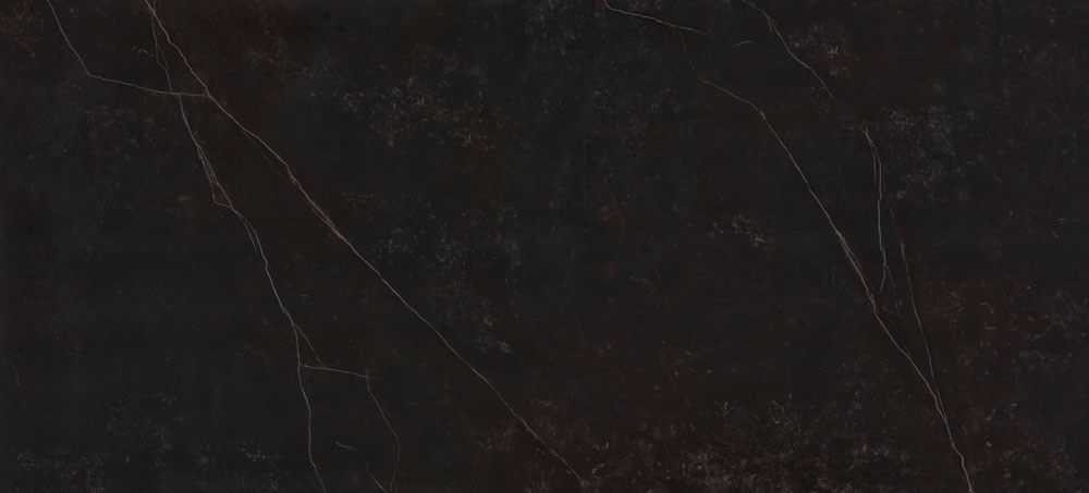 A dark, polished stone slab surface with subtle black, brown, and charcoal tones, marked by thin, light-colored veining.