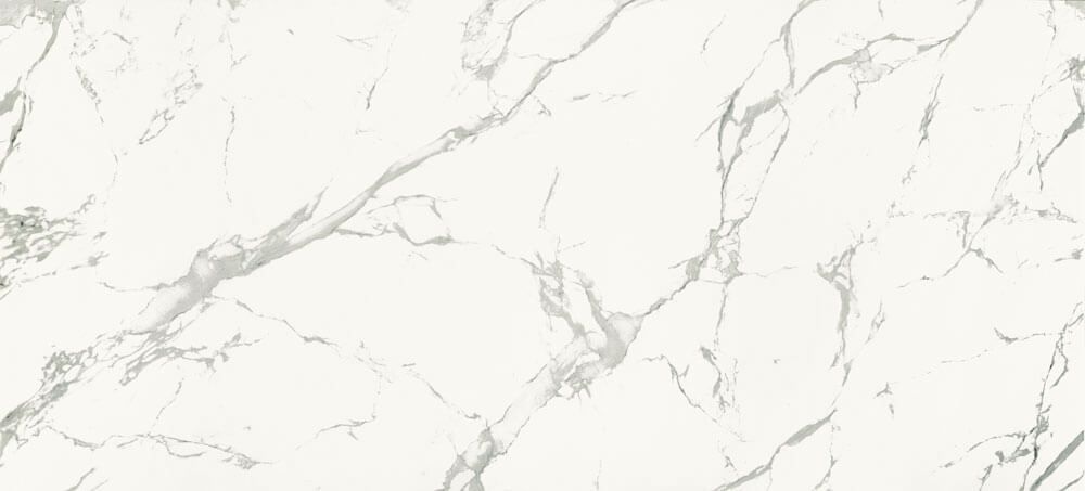 White marble surface with subtle, branching grey veins.