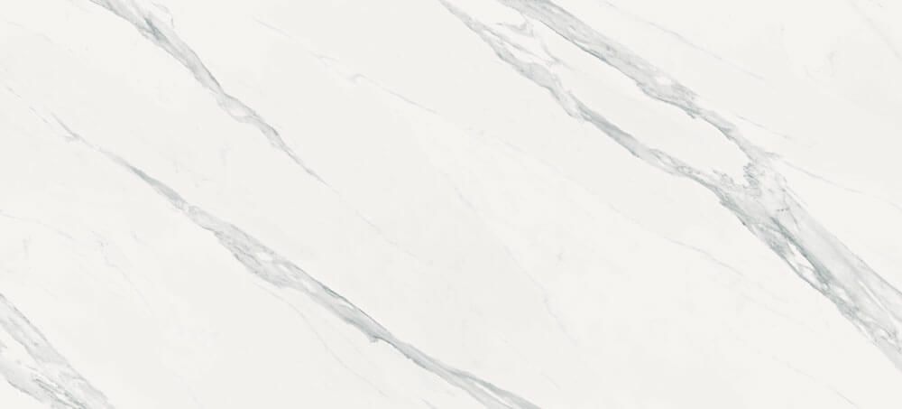 A white marble surface with light grey diagonal veining patterns.