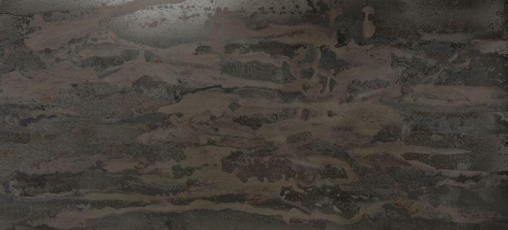 A textured stone surface with horizontal striations in shades of dark brown, charcoal, and warm gray.