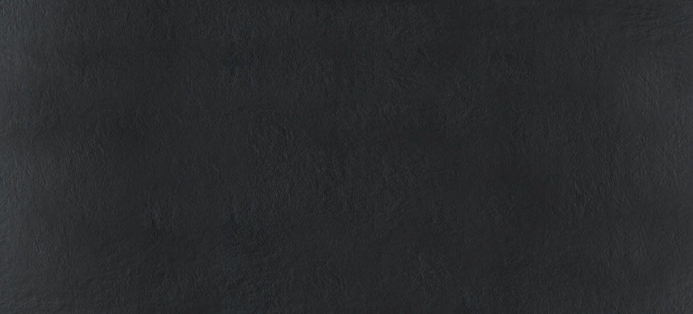 A uniform, matte black background with a slightly textured, grainy surface.
