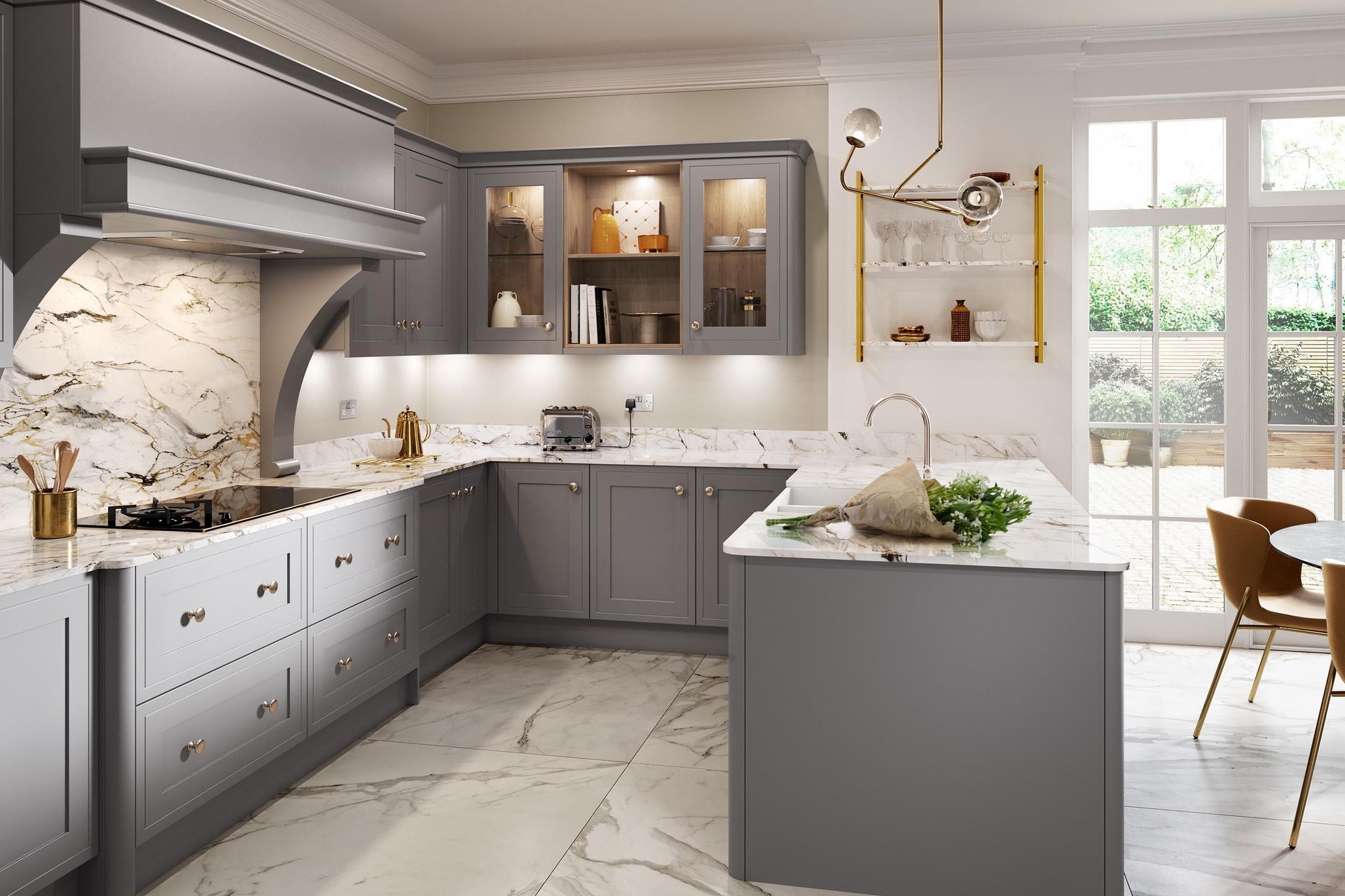 Modern gray kitchen with marble countertops, island, gold accents, and a bright windowed dining area