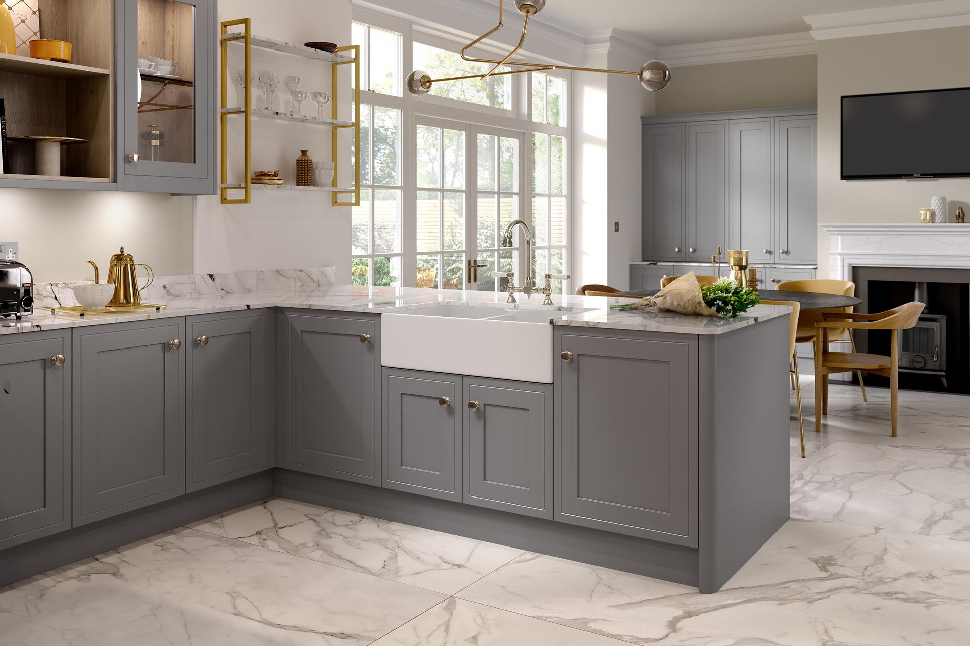 Modern gray kitchen with marble island, gold fixtures, large windows, and dining area