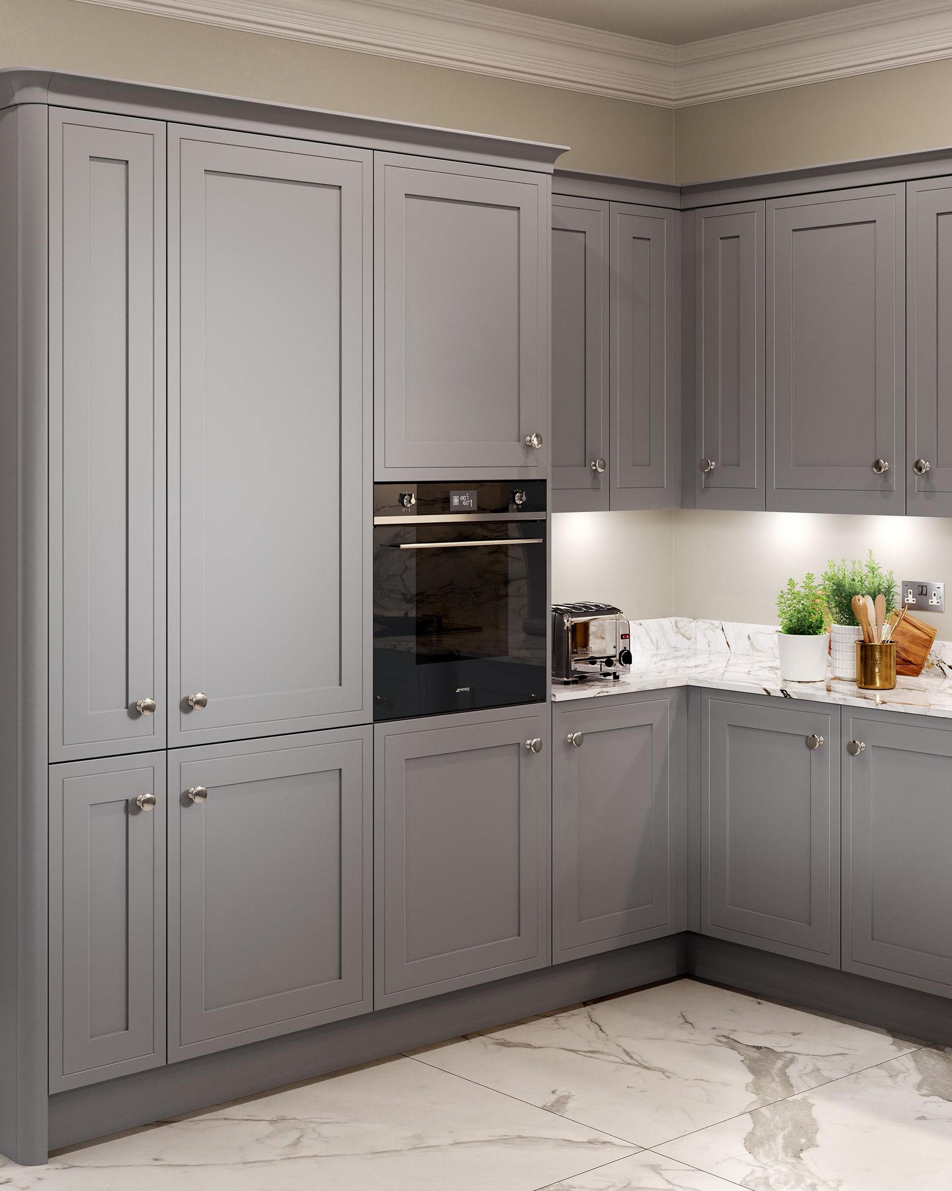 Gray corner kitchen with built-in oven, paneled cabinets, white countertop, and marble-look floor