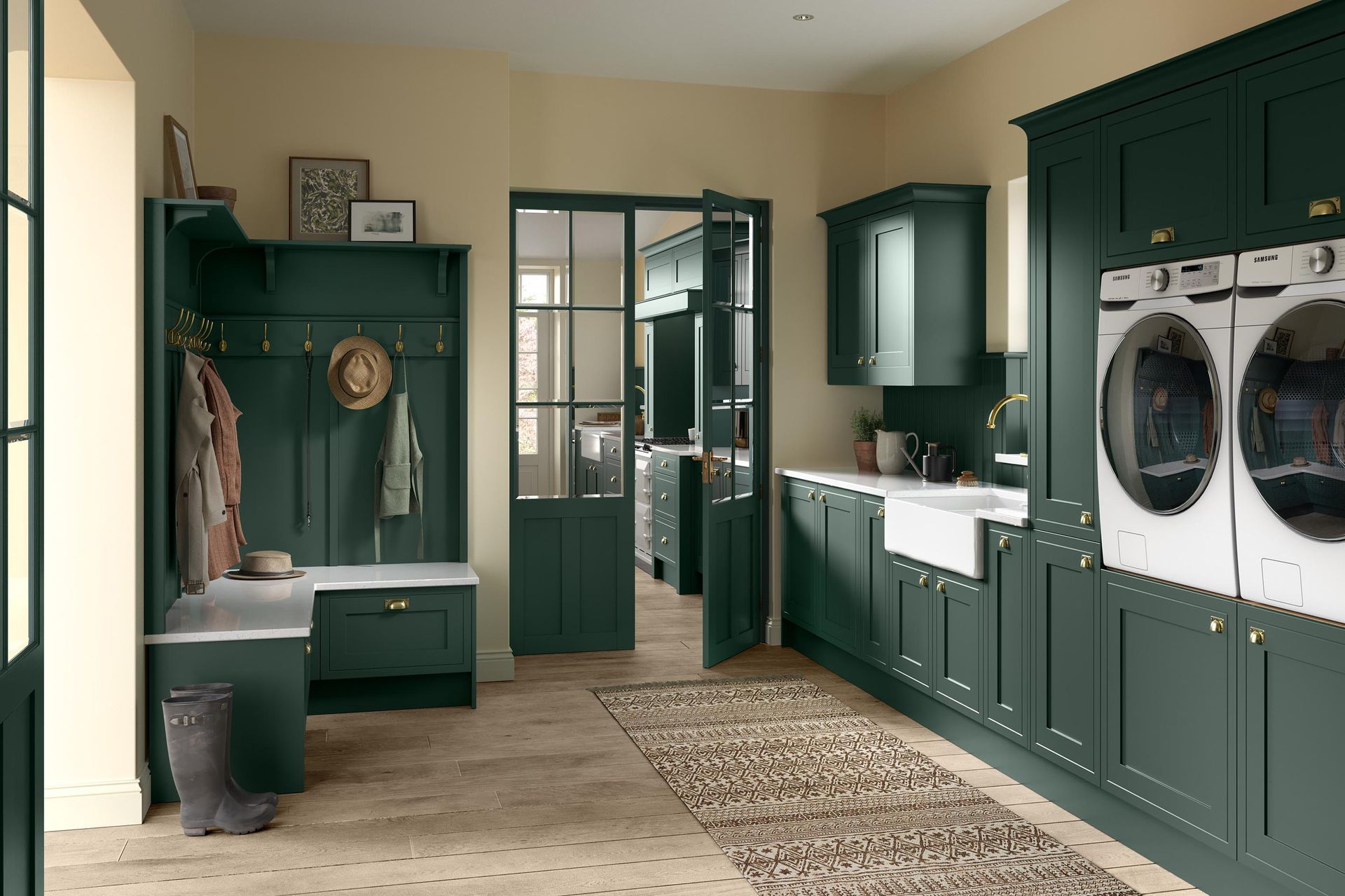 A laundry and mudroom featuring dark green cabinets, white appliances, a farmhouse sink, and wooden flooring.