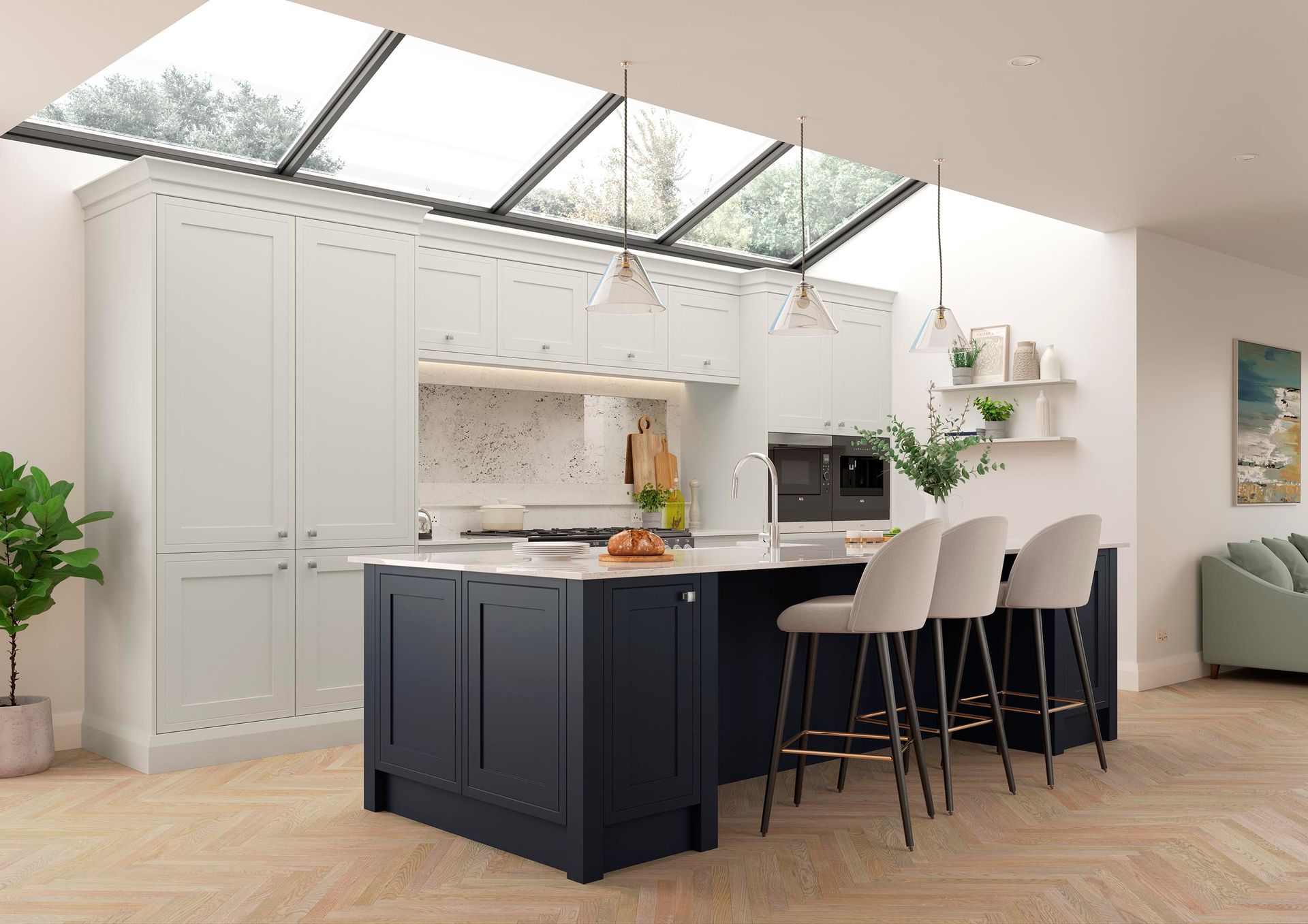 Modern kitchen with white cabinets, black island, bar stools, and skylights over wood floors