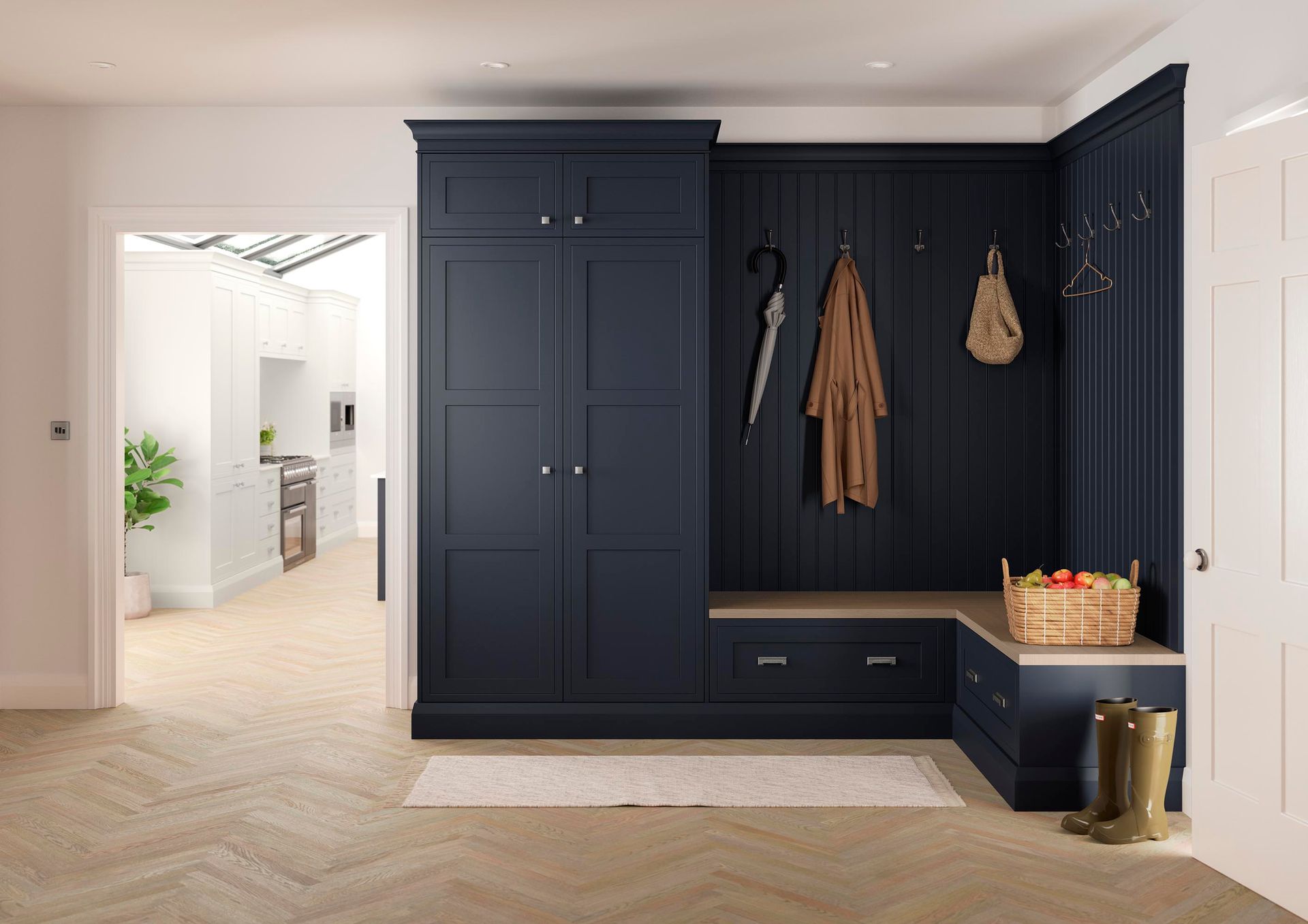 Dark navy mudroom storage with built-in cabinetry, coat hooks, bench seating, and drawers on a light wood floor.