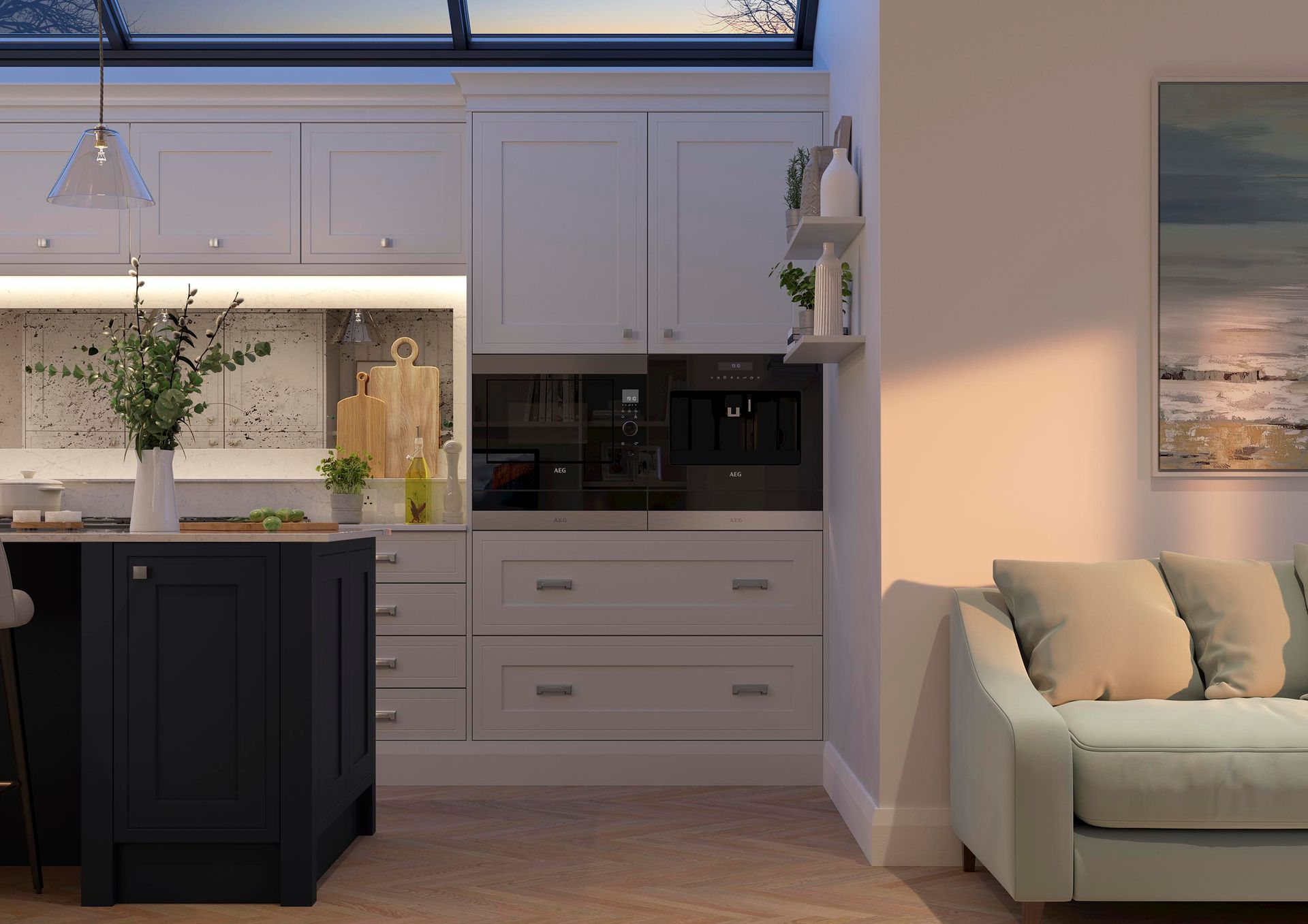 Modern kitchen with white cabinets, black island, flowers, and a beige sofa by a sunny window