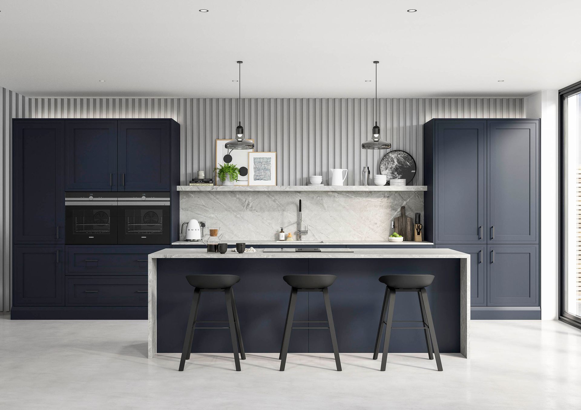 A modern kitchen featuring navy blue cabinets, a marble countertop, white striped wallpaper, and three black bar stools.