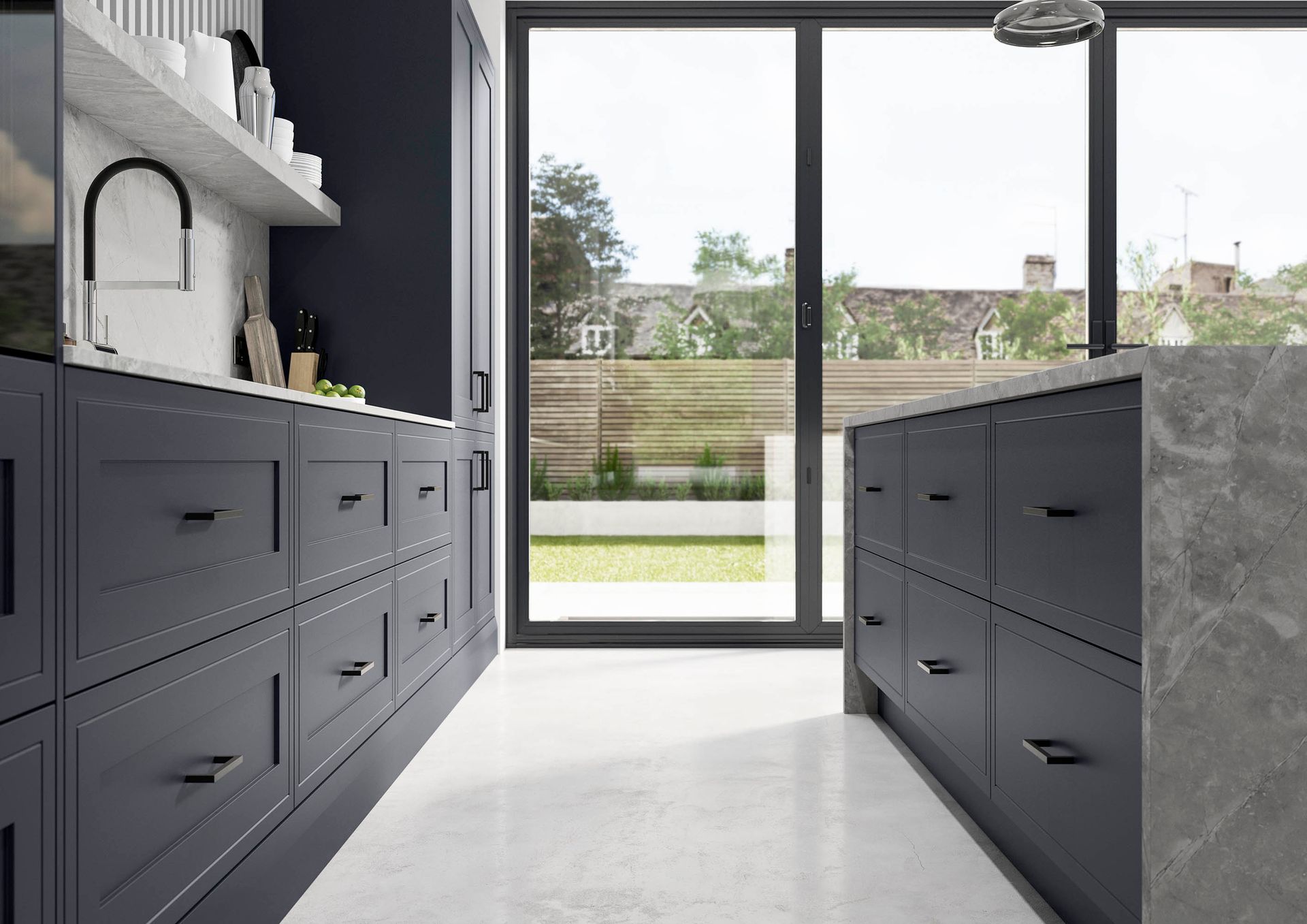 A modern kitchen with dark gray shaker-style cabinets and a gray stone island, featuring a view through sliding glass doors.