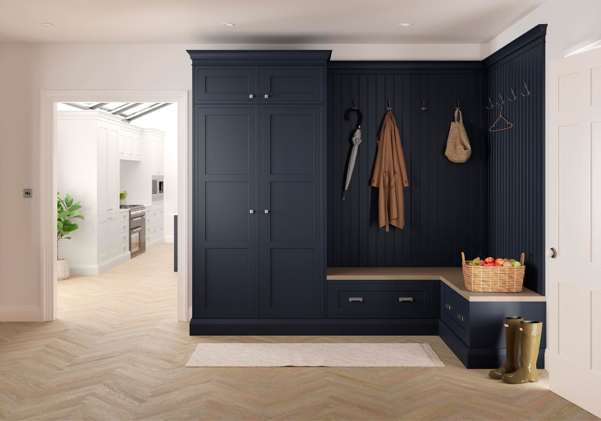 Modern entryway with dark blue built-in storage, bench, and coat hooks in a bright home interior