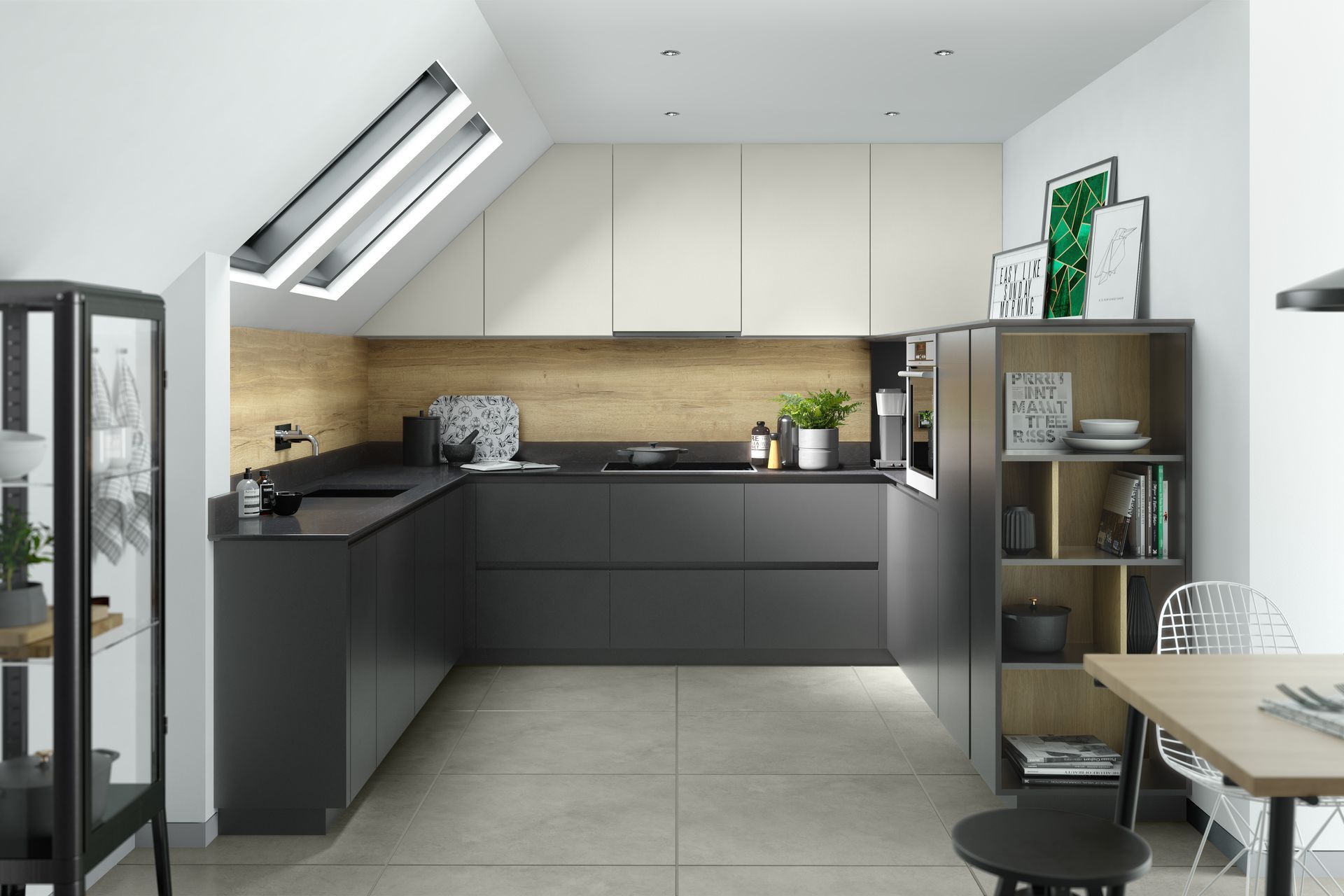 A modern kitchen with matte dark grey cabinets, light wooden backsplash, and cream upper cabinets under a slanted ceiling.
