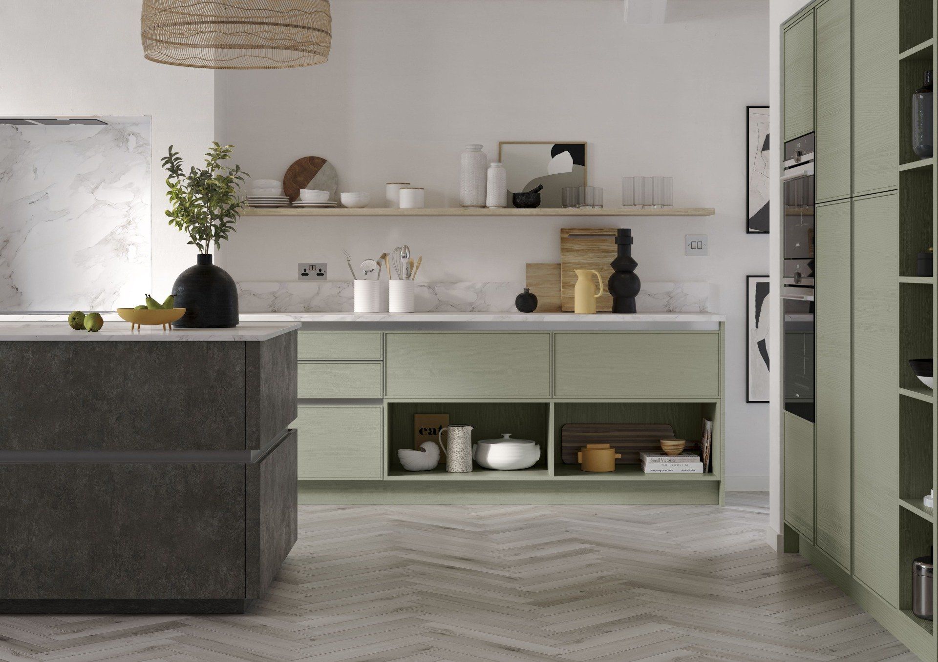 A modern kitchen with sage green cabinets, a dark grey kitchen island, and light wood herringbone flooring.