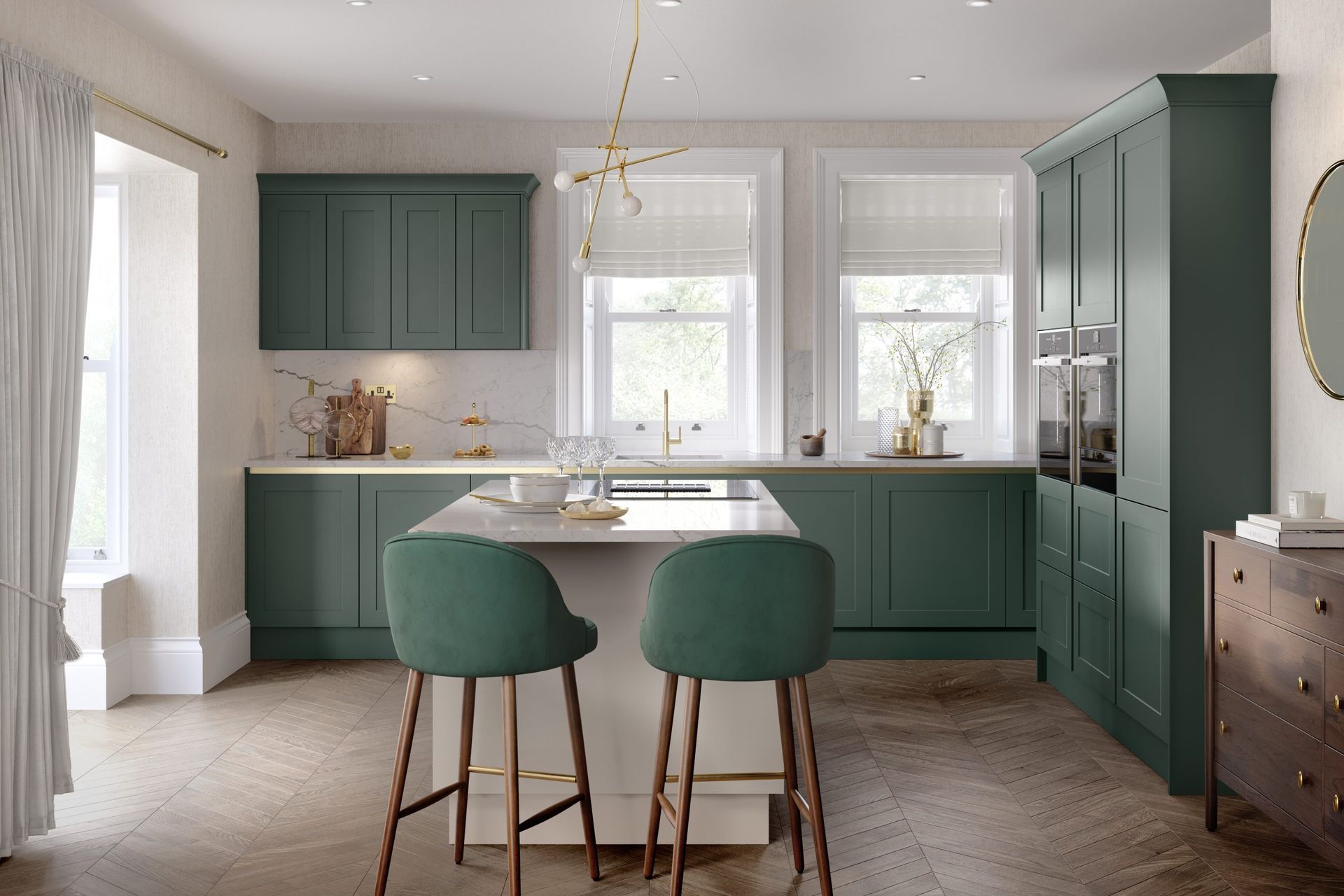 A modern kitchen featuring matte green cabinets, a central island with two green bar stools, and light-toned flooring.