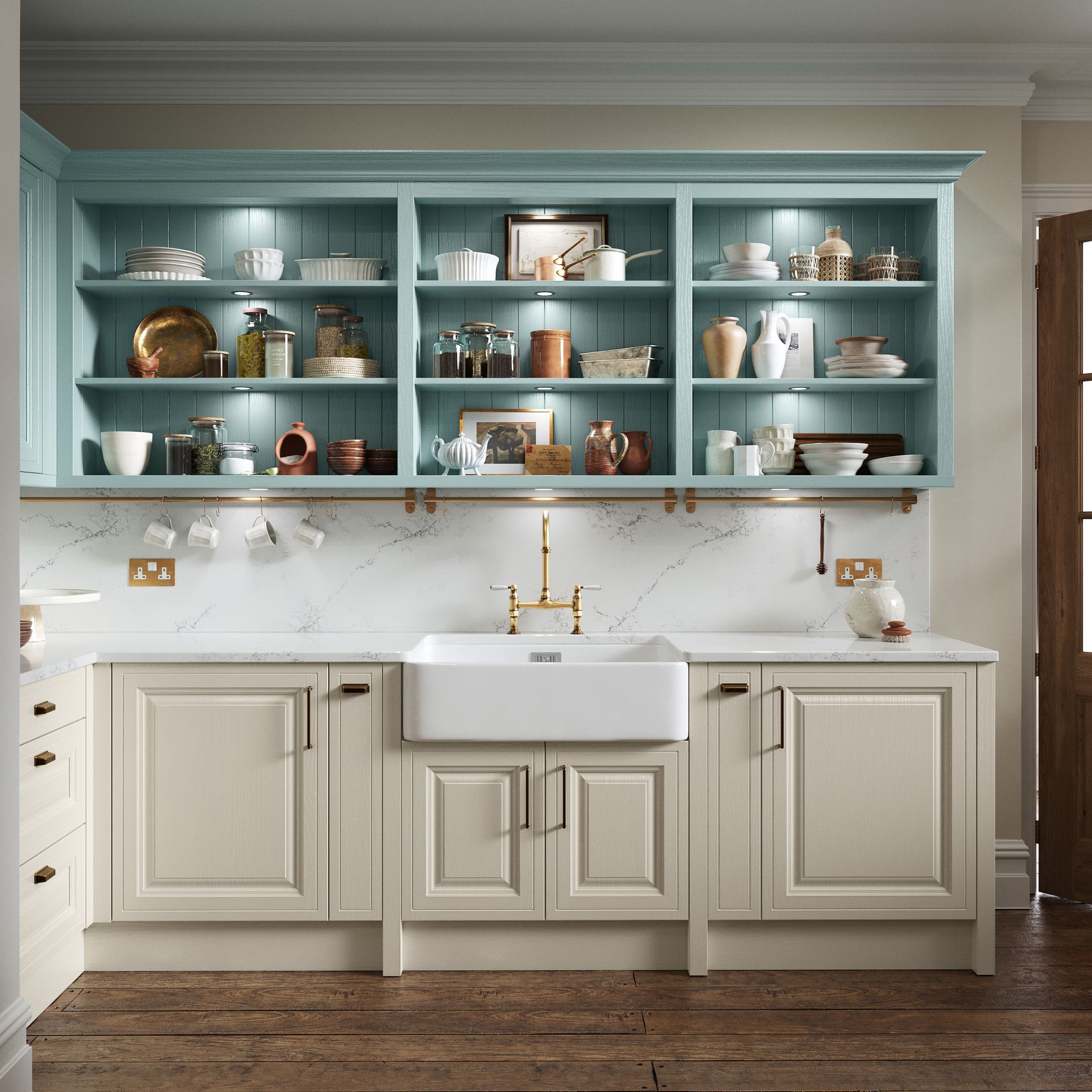 A kitchen featuring cream-colored cabinets, a white apron-front sink, and blue open shelving filled with decorative items.