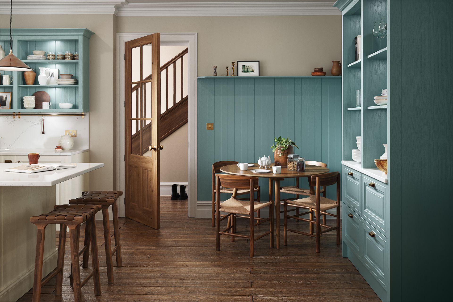A bright kitchen featuring teal cabinets, a round wooden dining table, a kitchen island with stools, and an open doorway.