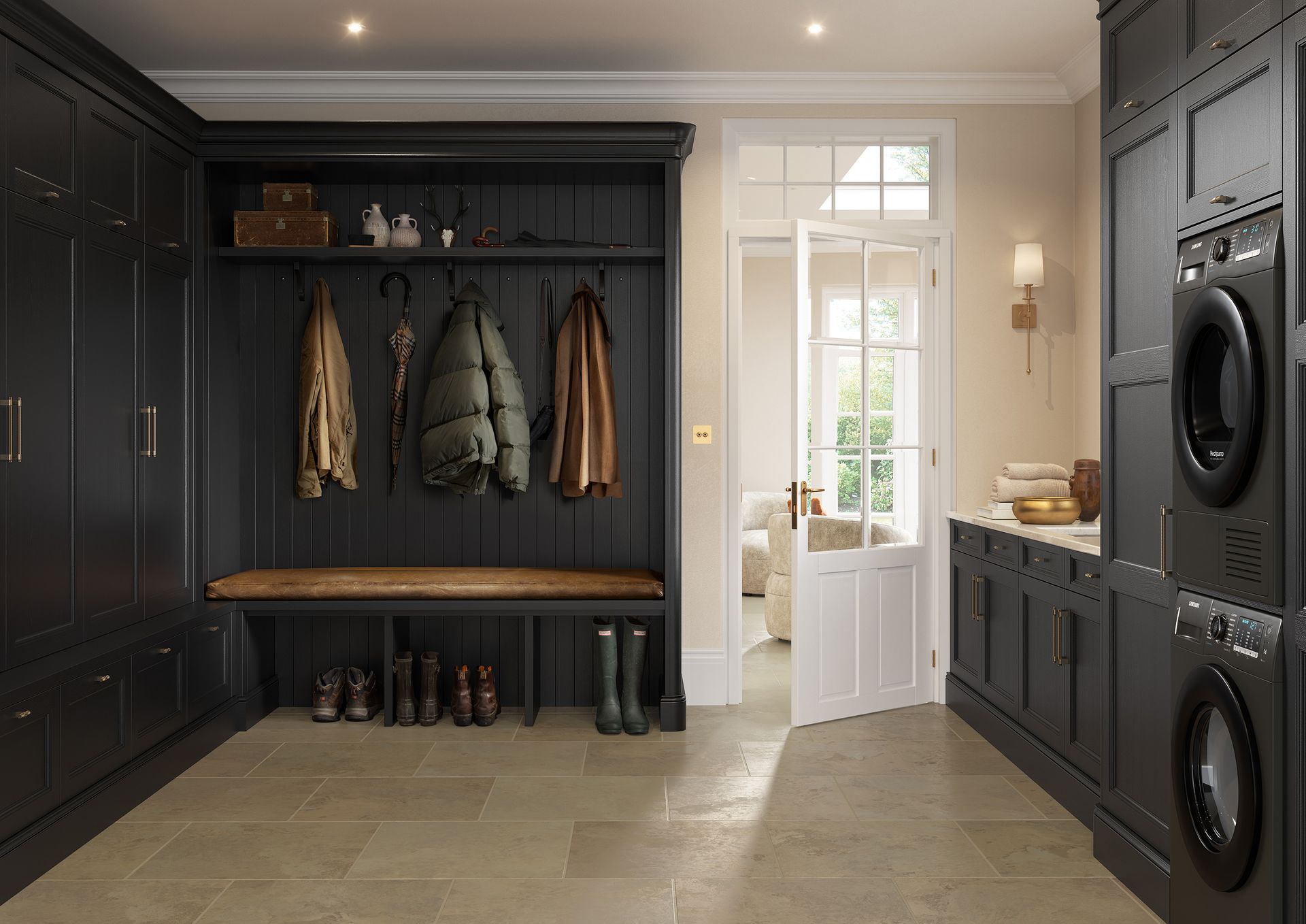 Built-in mudroom with dark cabinets, bench, coat hooks, and stacked washer-dryers beside a bright doorway