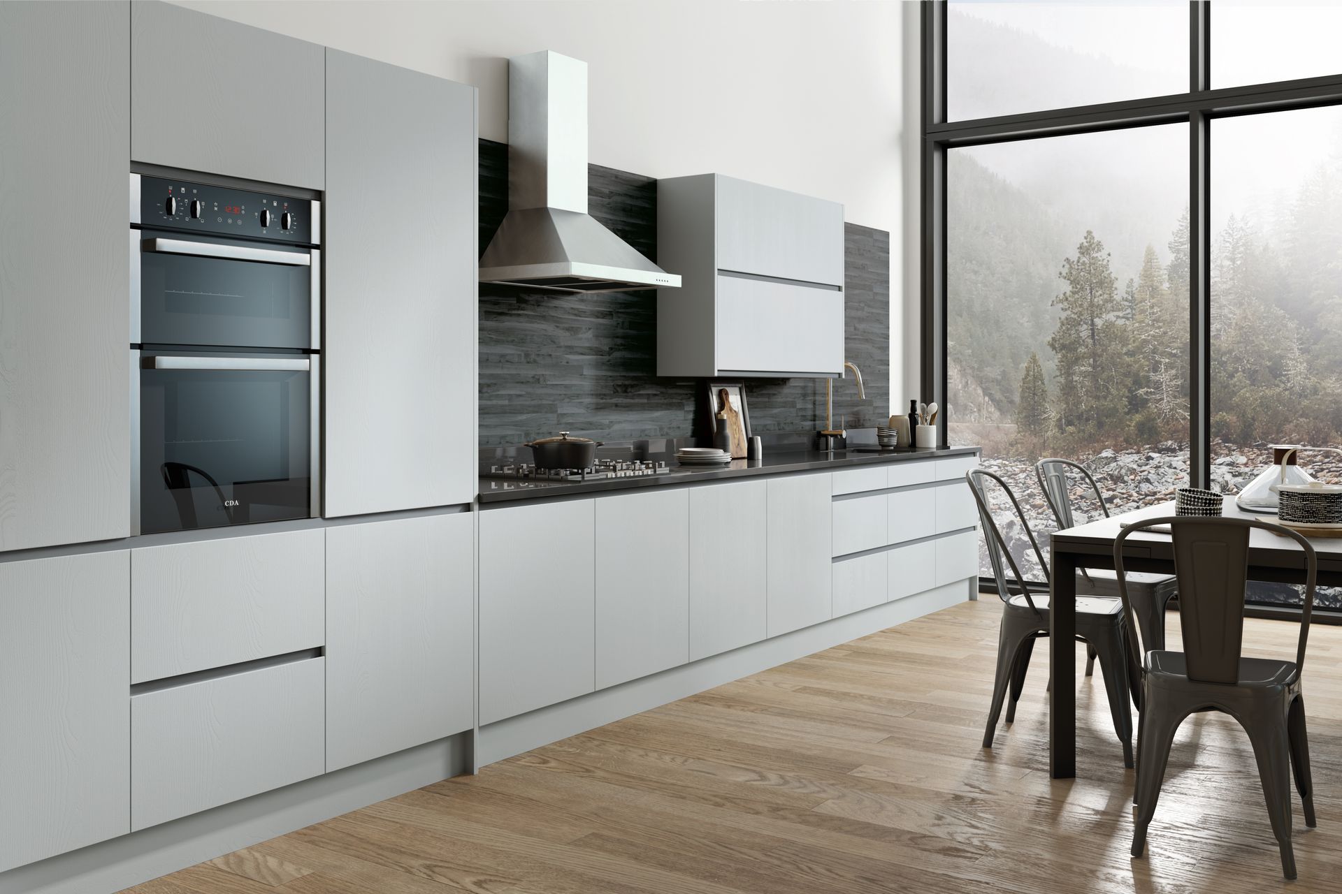 Modern light gray kitchen cabinets with a stainless steel oven and range hood, featuring a black tiled wall and dining area.