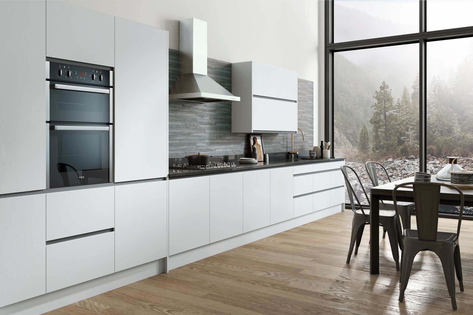 A sleek, modern white kitchen featuring flat-panel cabinets, a built-in oven, and large windows with a nature view.