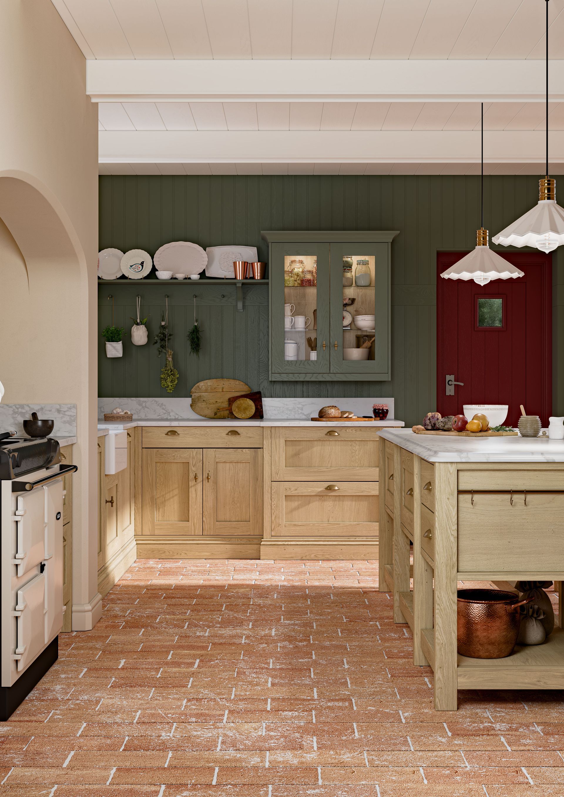 A rustic kitchen with natural wood cabinets, dark green walls, terracotta brick floors, and a deep red door.